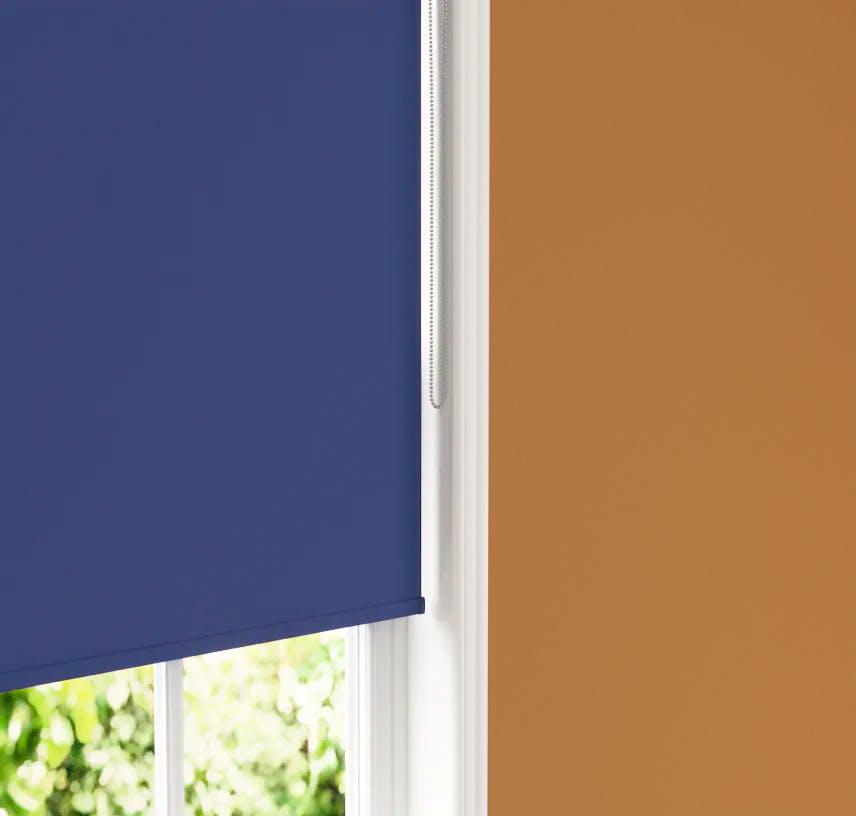 Close up of Lick Blue 08 roller blind against an Orange 02 wall