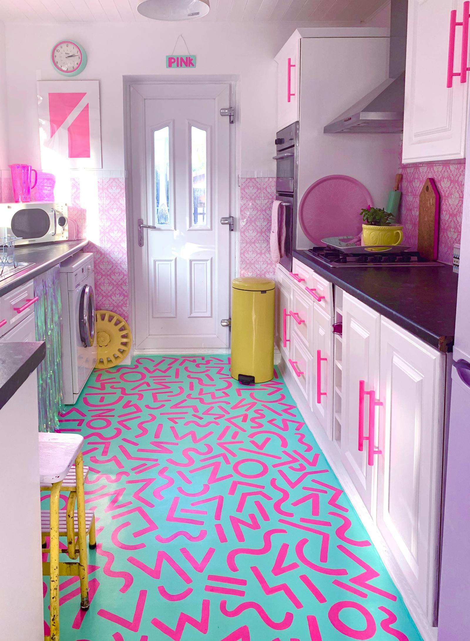 Pink kitchen with bright pink and teal flooring