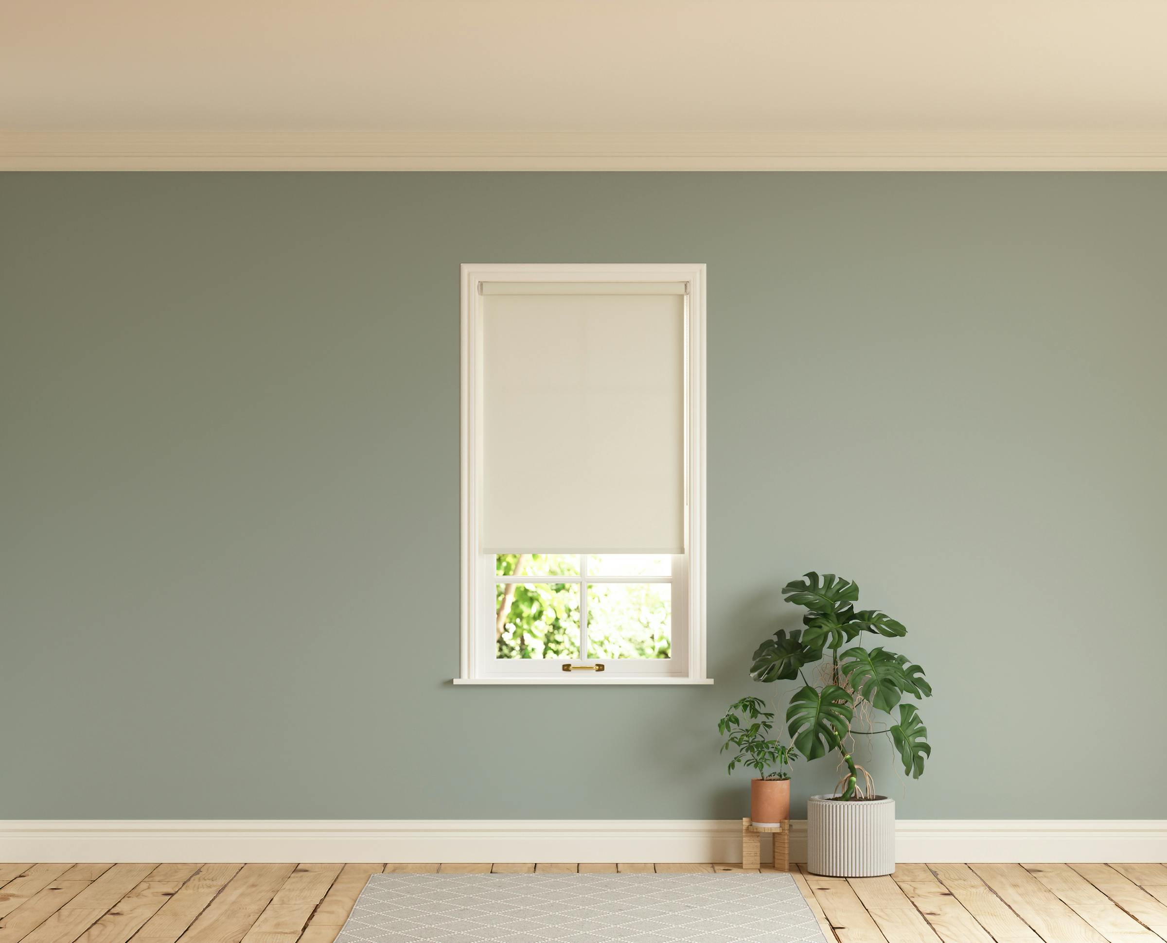Room with walls painted in Lick Teal 01 and White 05 roller blinds