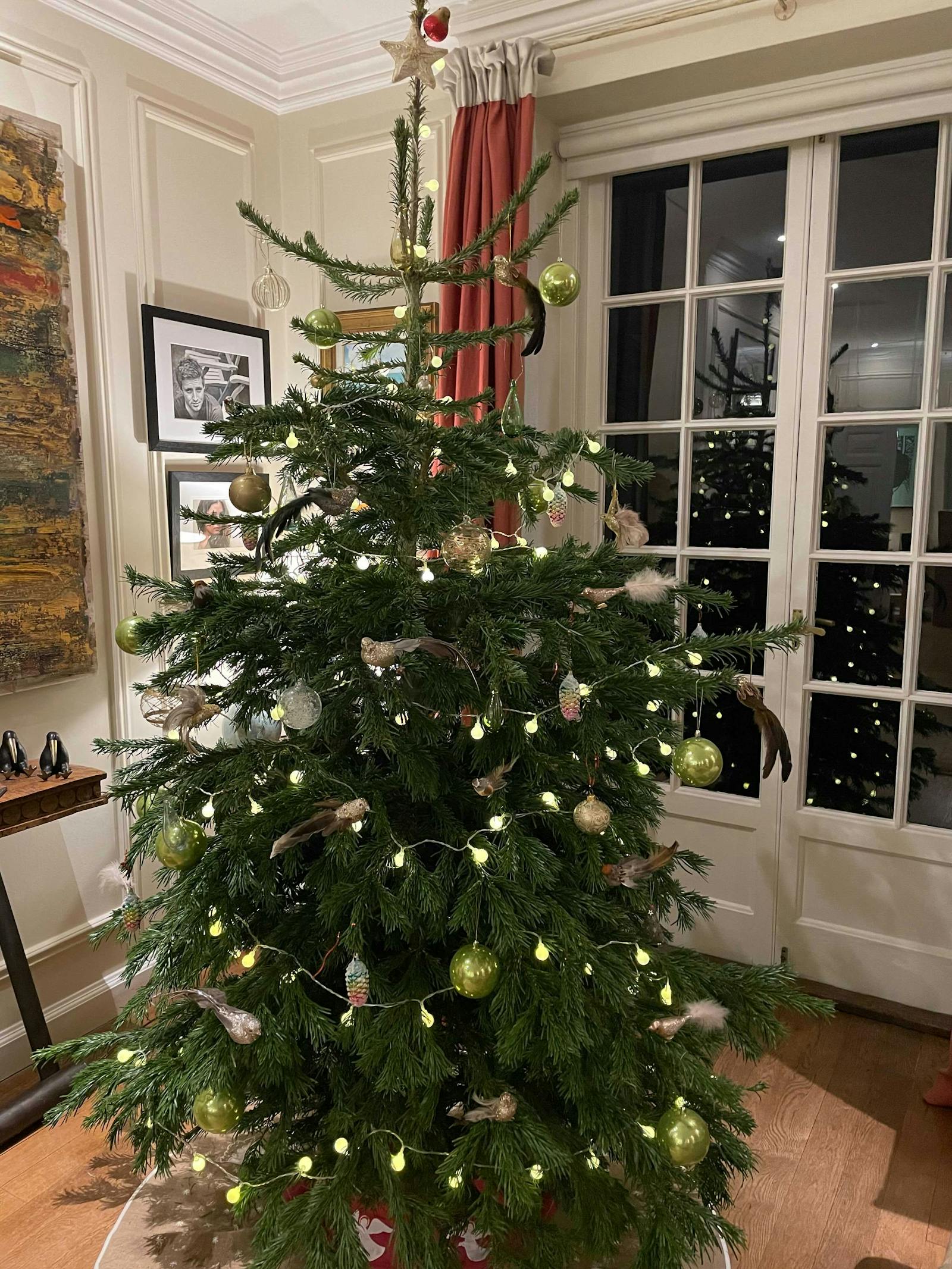 Christmas tree decorated in dainty bird baubles