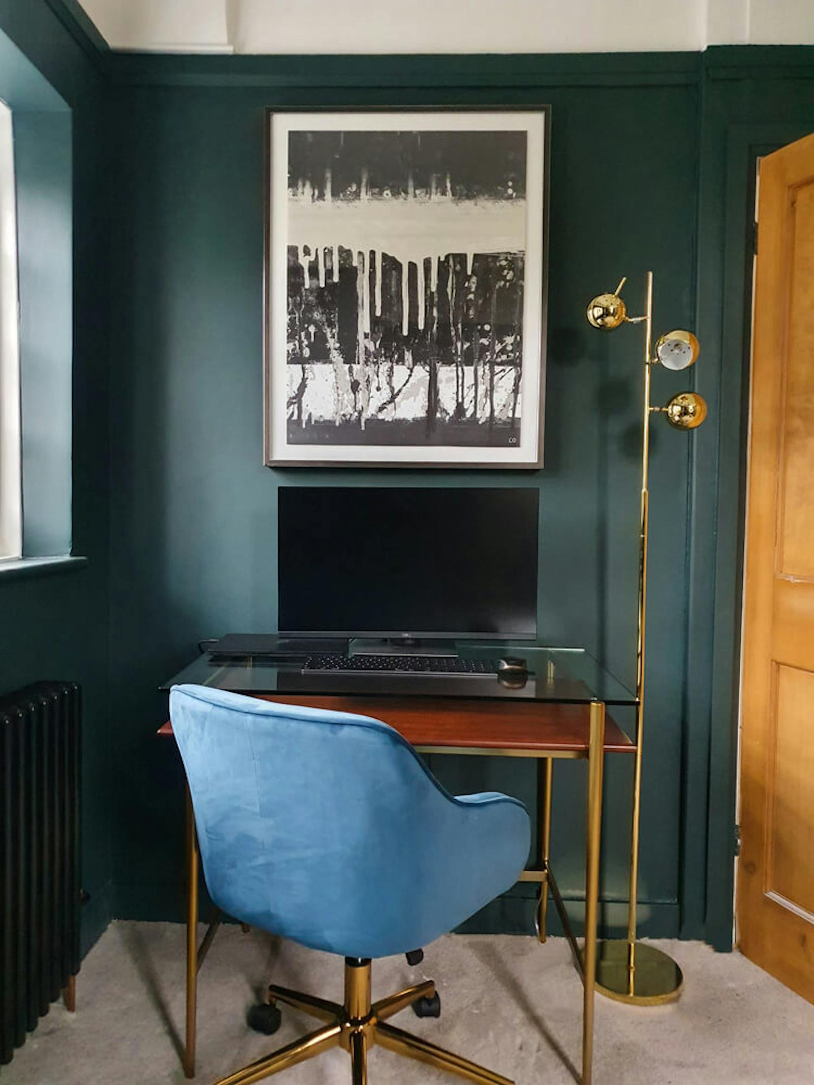 Home office with dark green walls