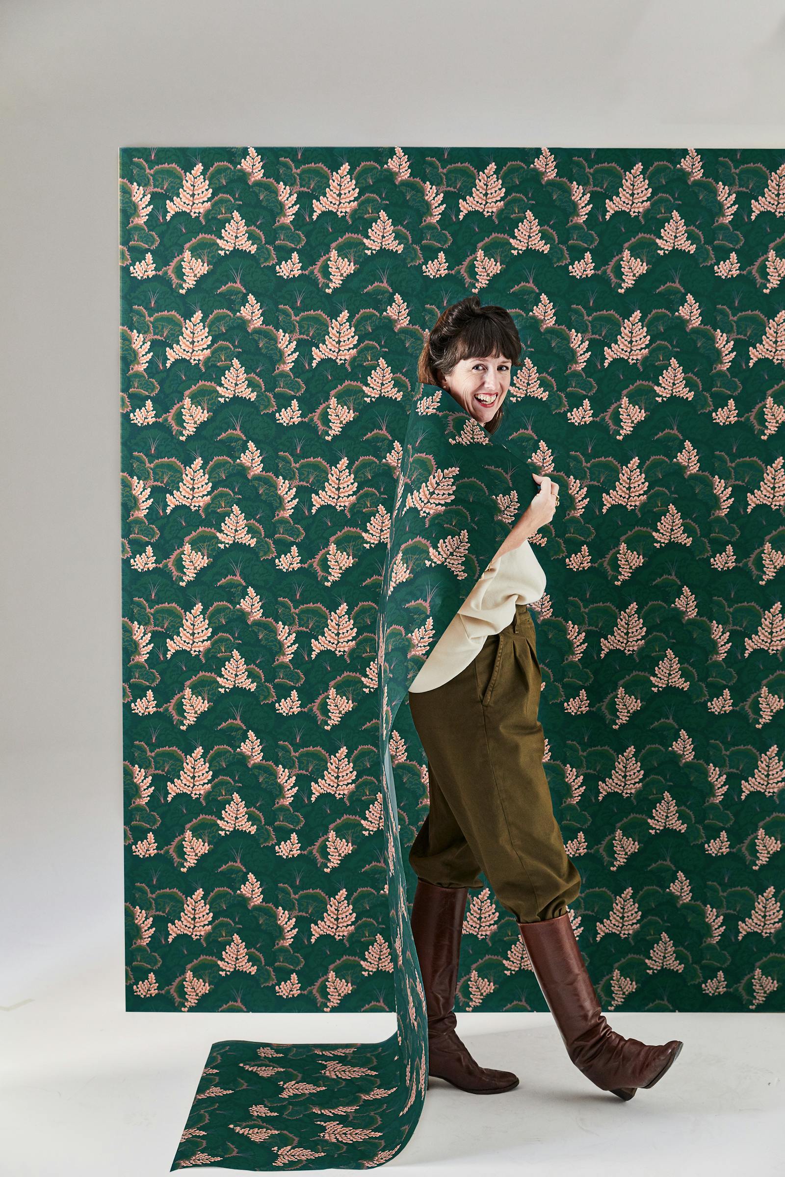 Natasha Coverdale standing in front of Lick Electric Poppies 02 wallpaper