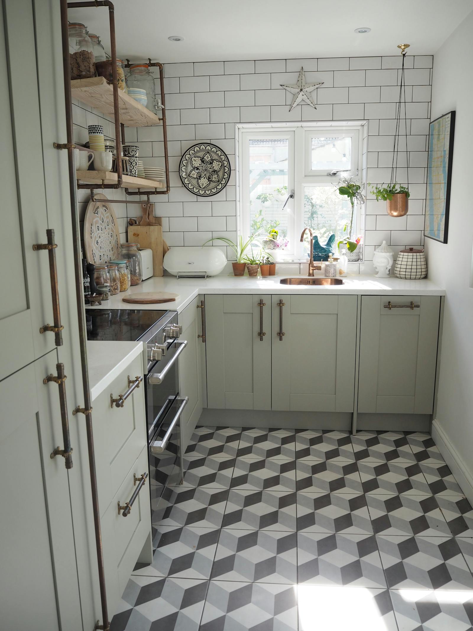 Neutral kitchen with patterned tiles on the floor and metro tiles on the wall