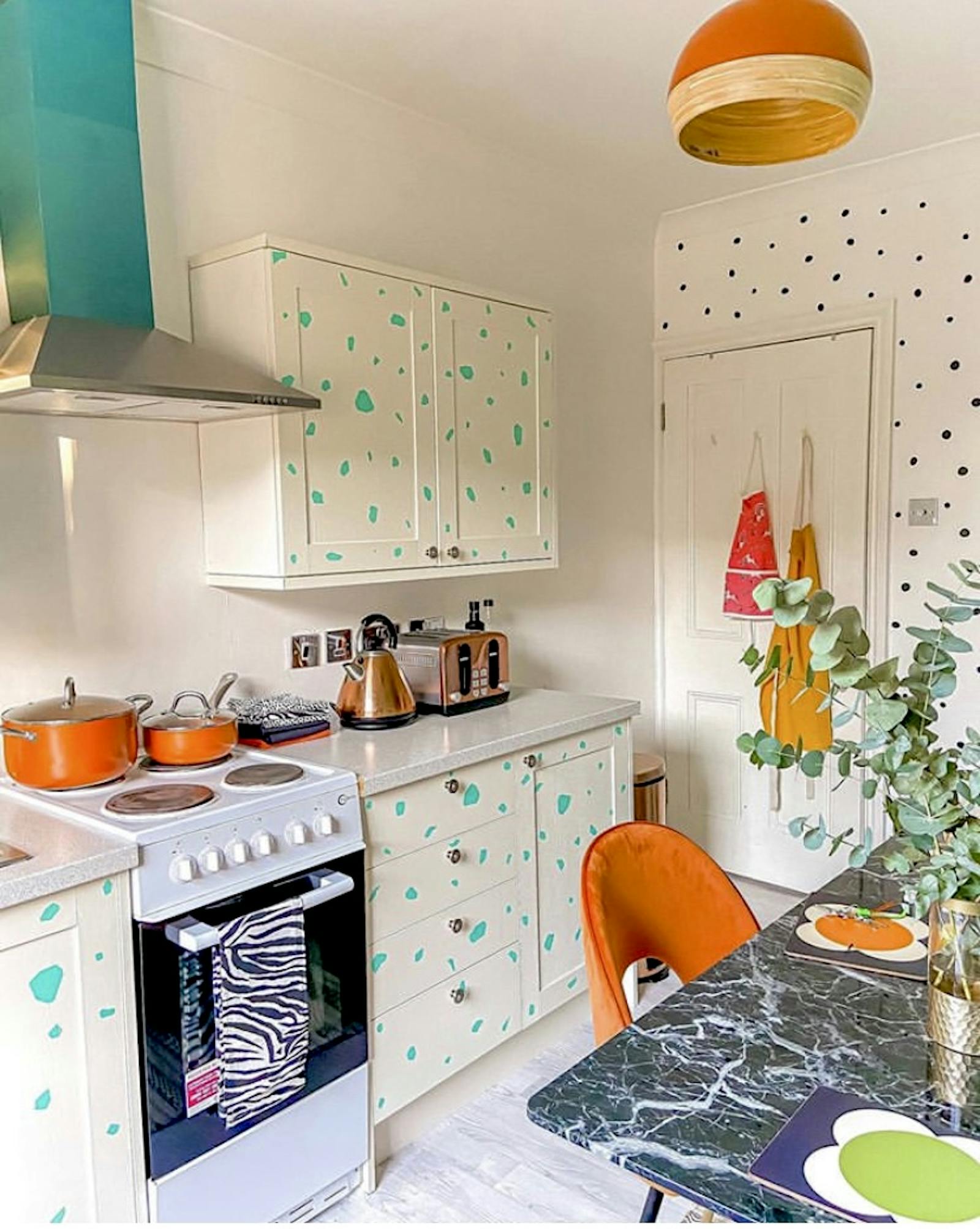 Brightly coloured kitchen with polkadot kitchen cupboards