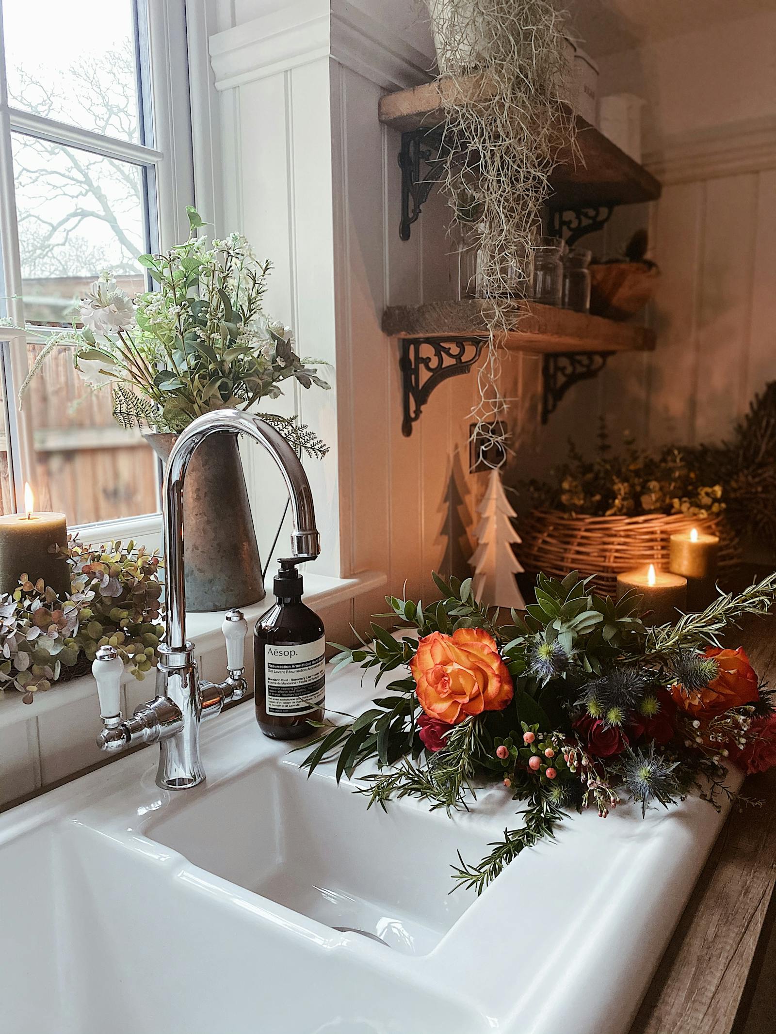 Kitchen sink with soap and fresh flowers