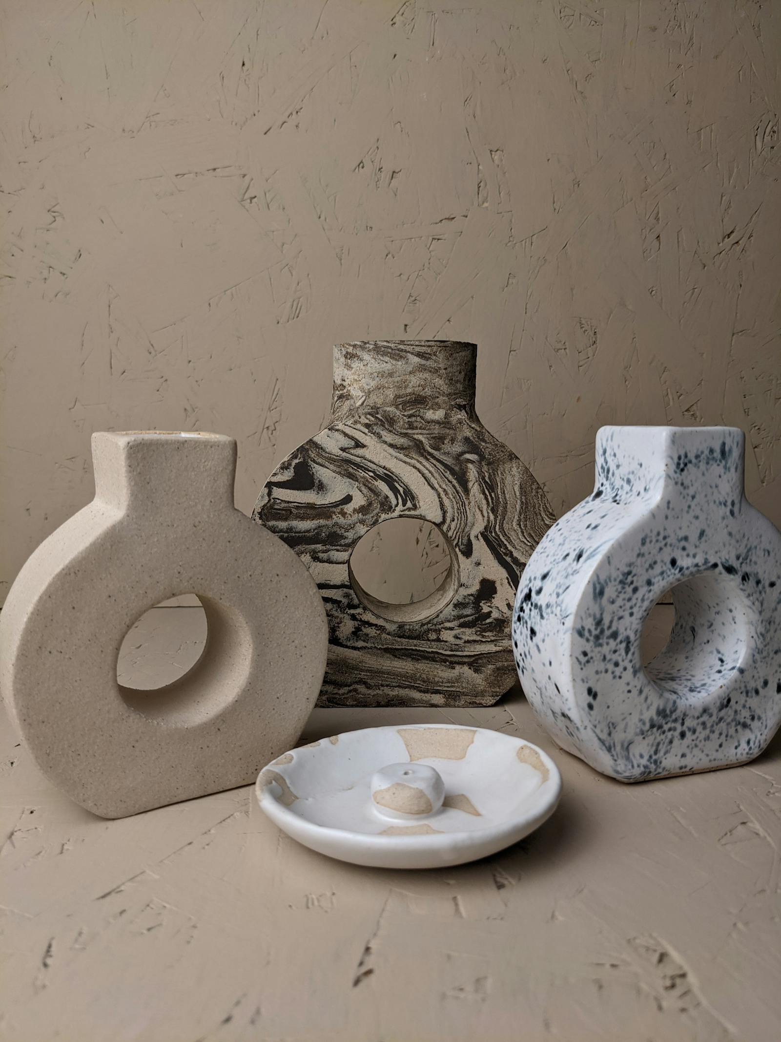 An assortment of vases with unique prints on them