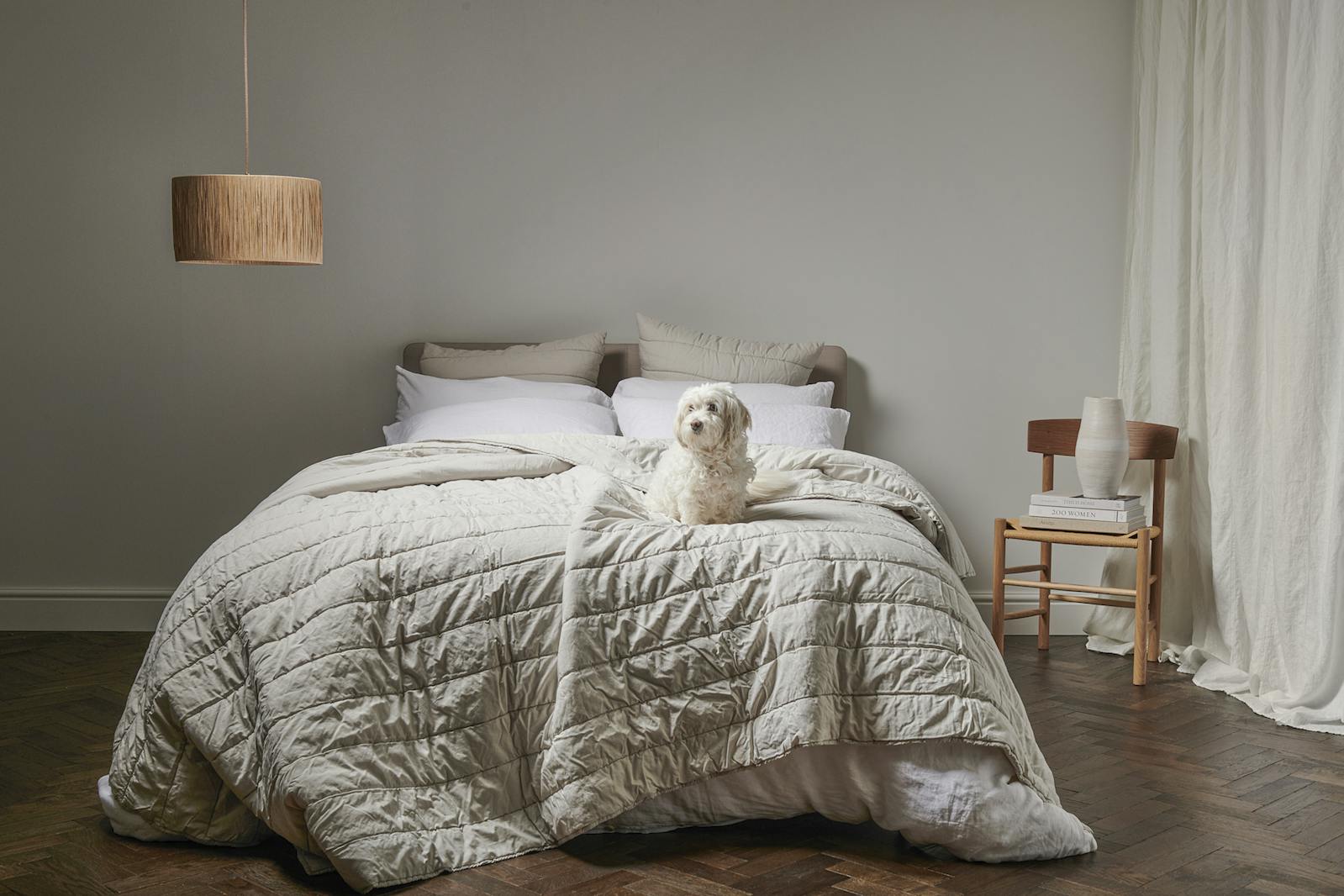 Bedfolk layered bedding in a beige and calming room setting
