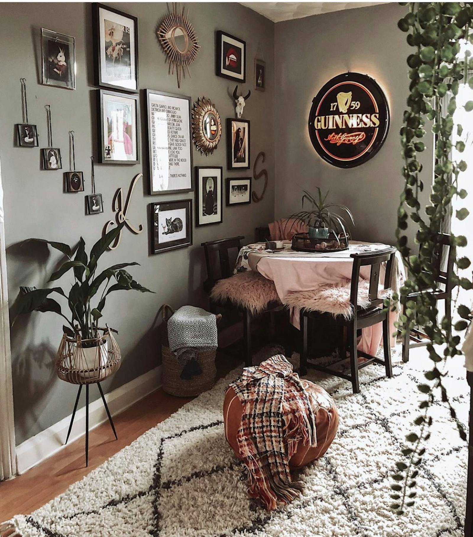 Dining room corner with lots of textures and plants around