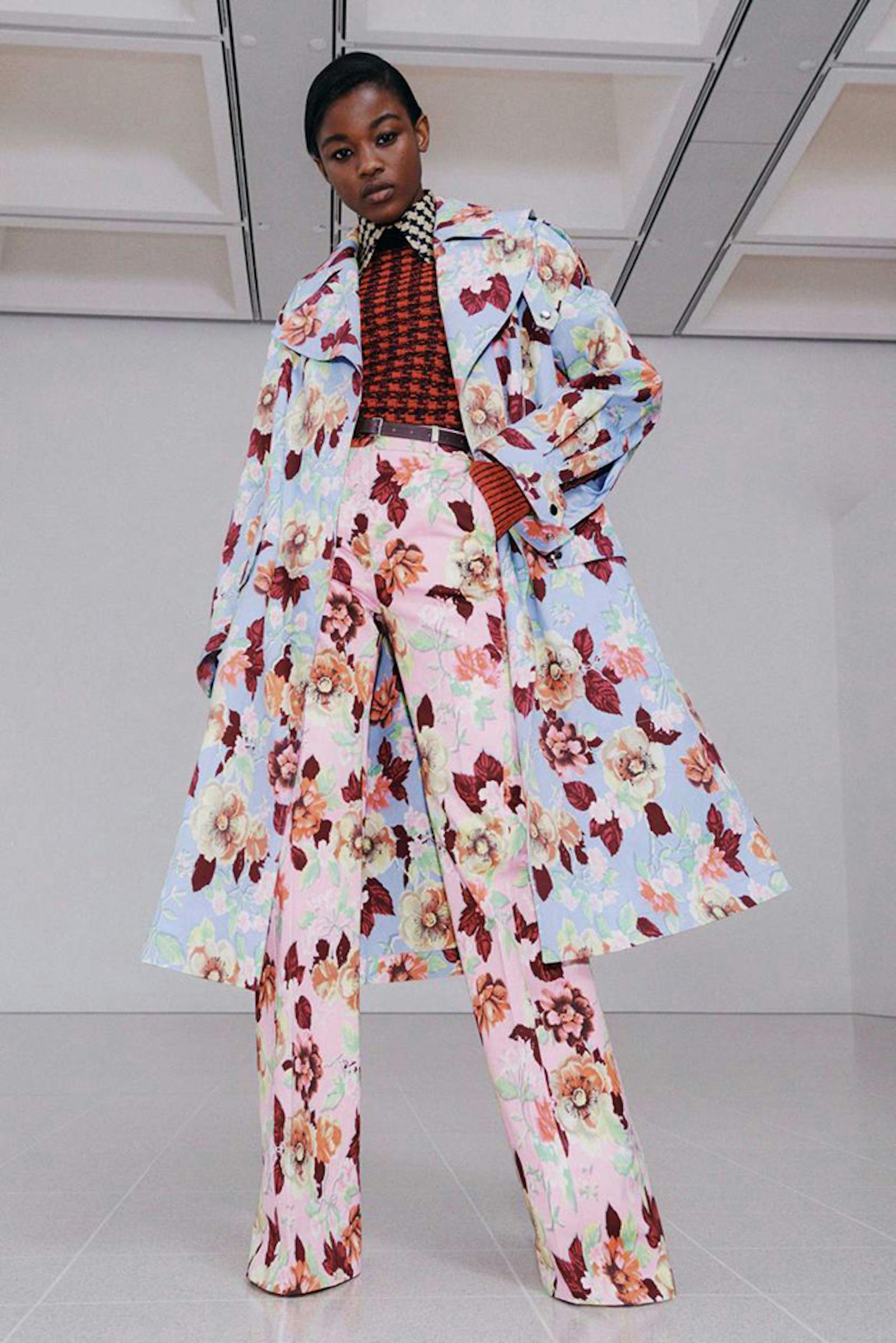 London fashion week shot of woman wearing loud floral and geometric patterned outfit