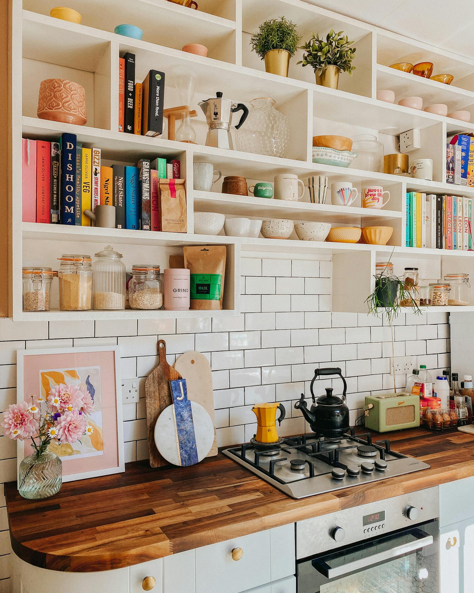 Kitchen with wooden countertop and white metro tiles