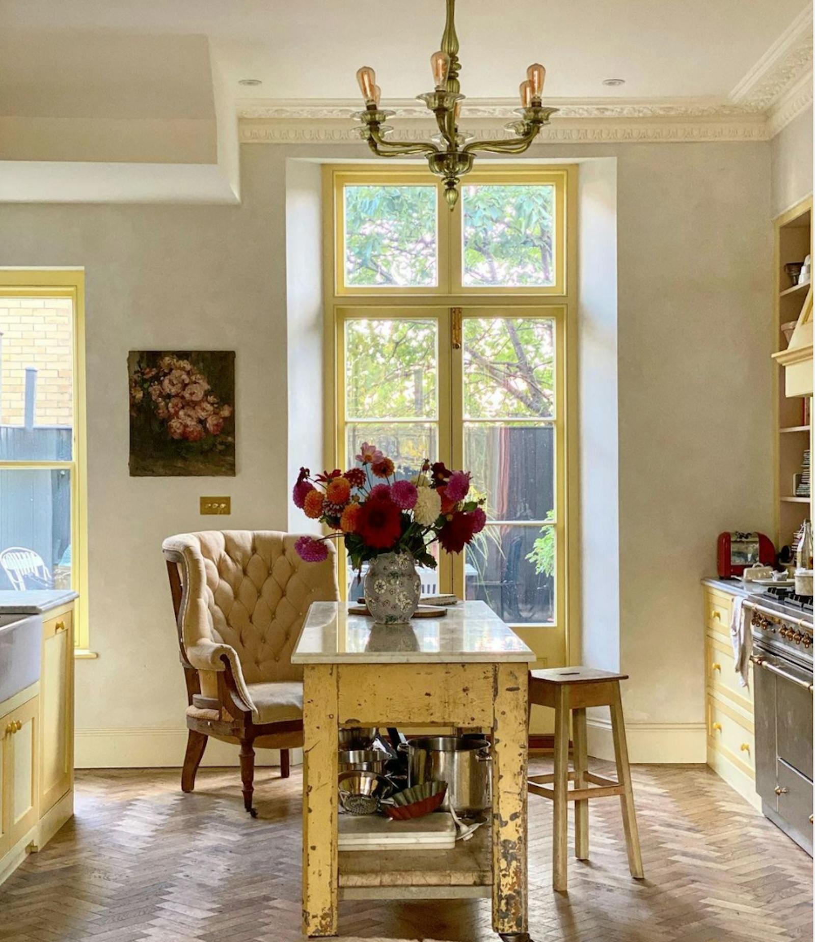 Kitchen with yellow furniture and windows