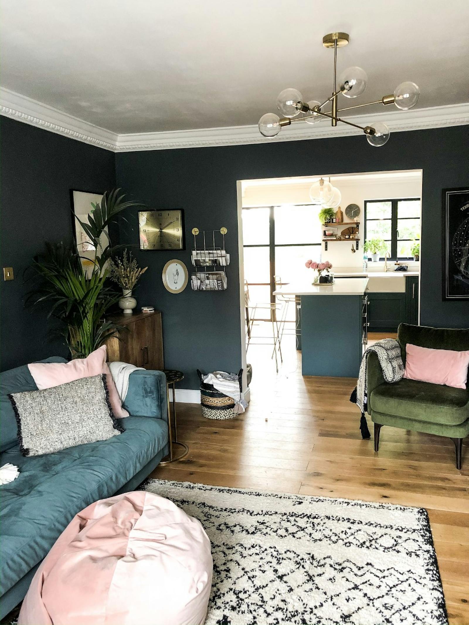 Living room painted in a dark teal colour