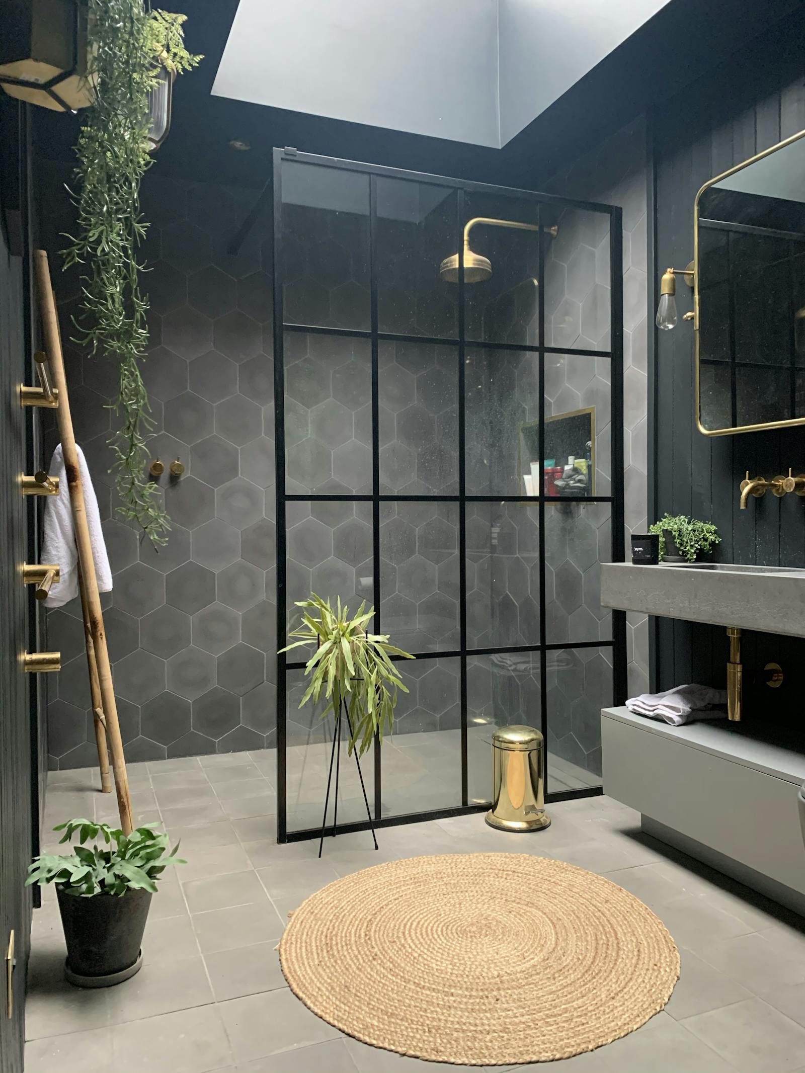 Monochrome minimal bathroom with geometric tiles