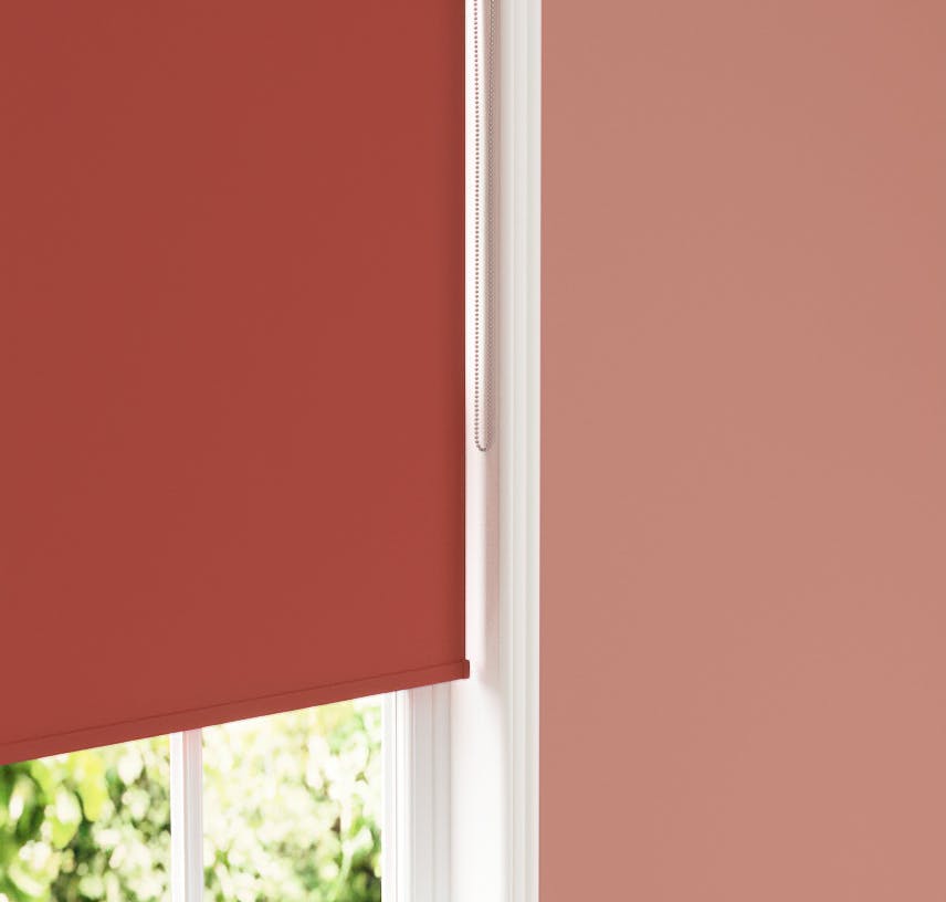 Close up of Lick Red 02 roller blind against Lick Red 01 wall