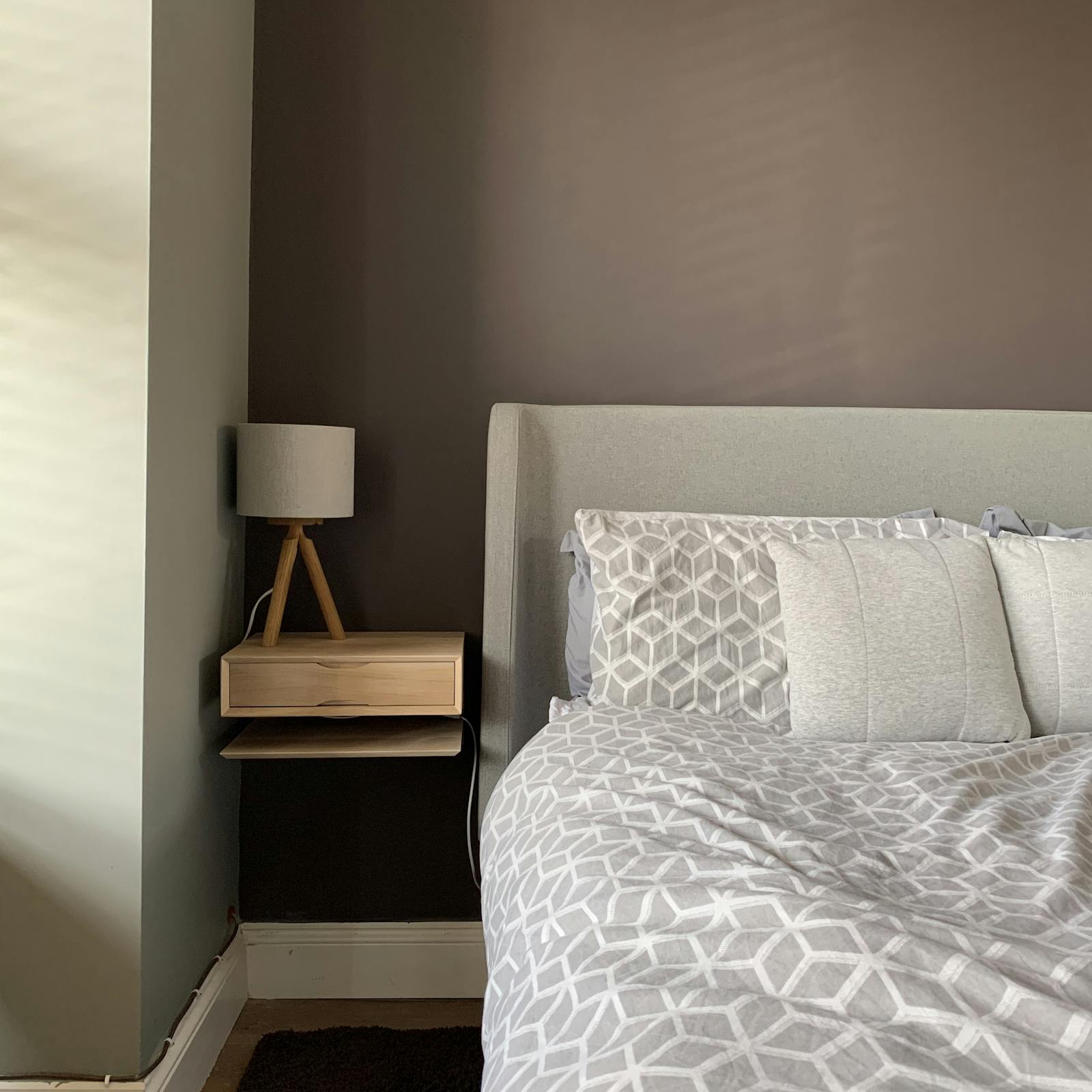 Neutral bedroom with floating nightstand and Lick Brown 01 walls