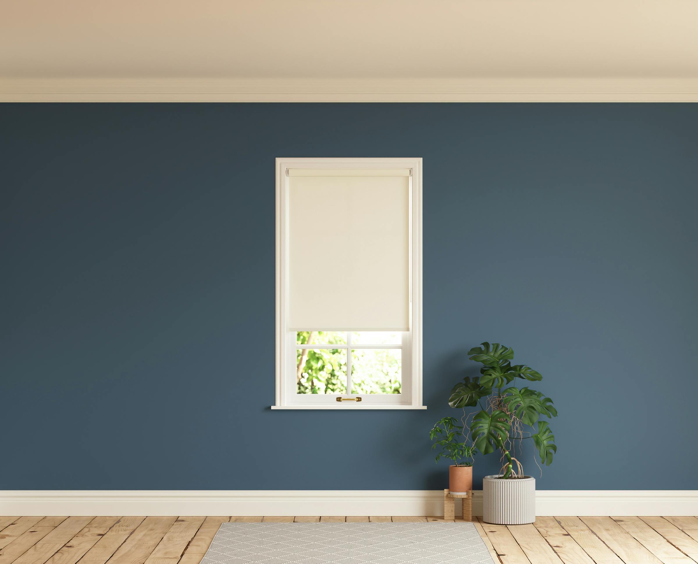 Room with walls painted in Lick Blue 06 and White 01 roller blinds