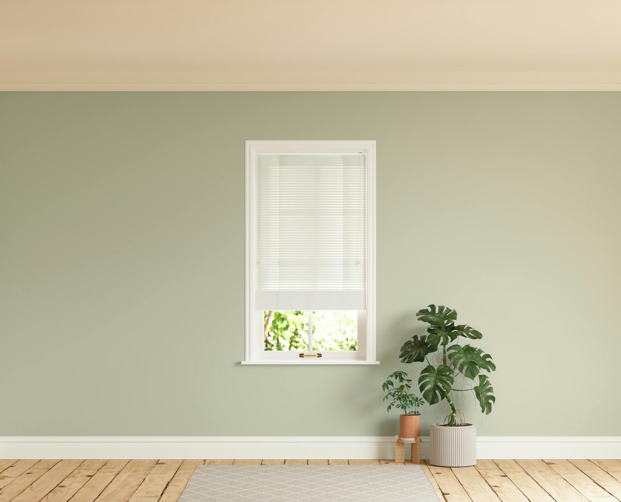 Room with walls painted in Lick Green 01 and White 01 Venetian blinds