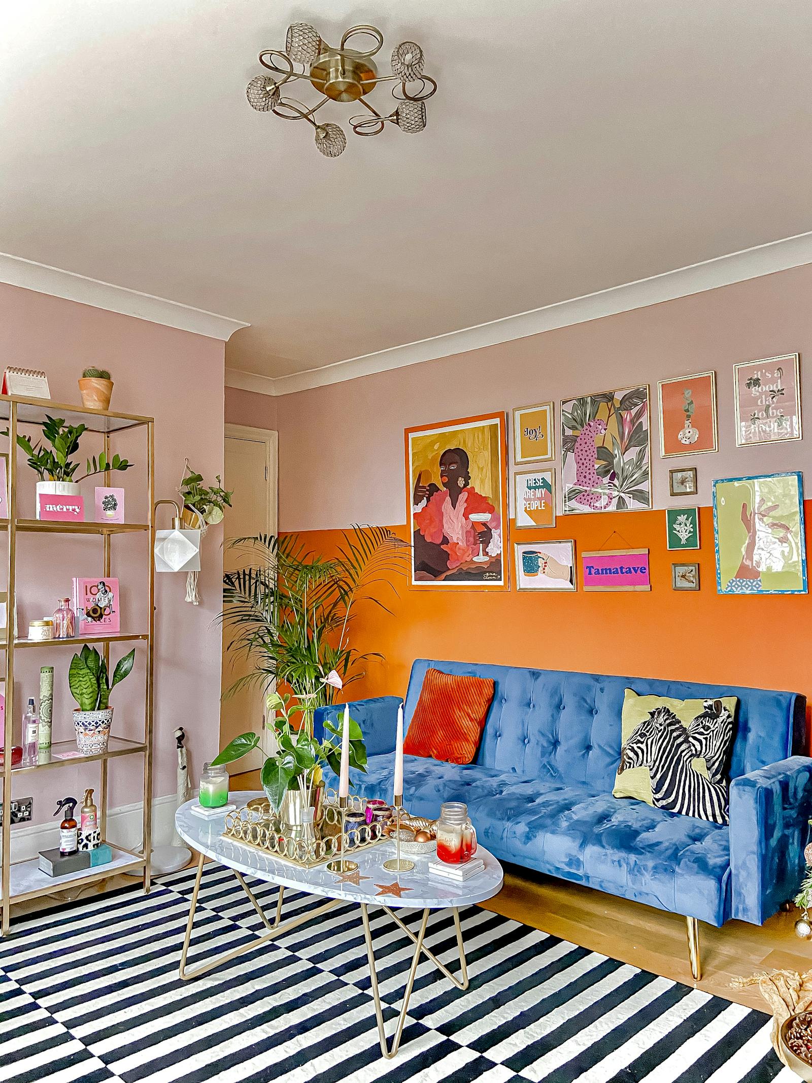 Brightly coloured living room with walls colour blocked in orange and Lick Pink 03 paint