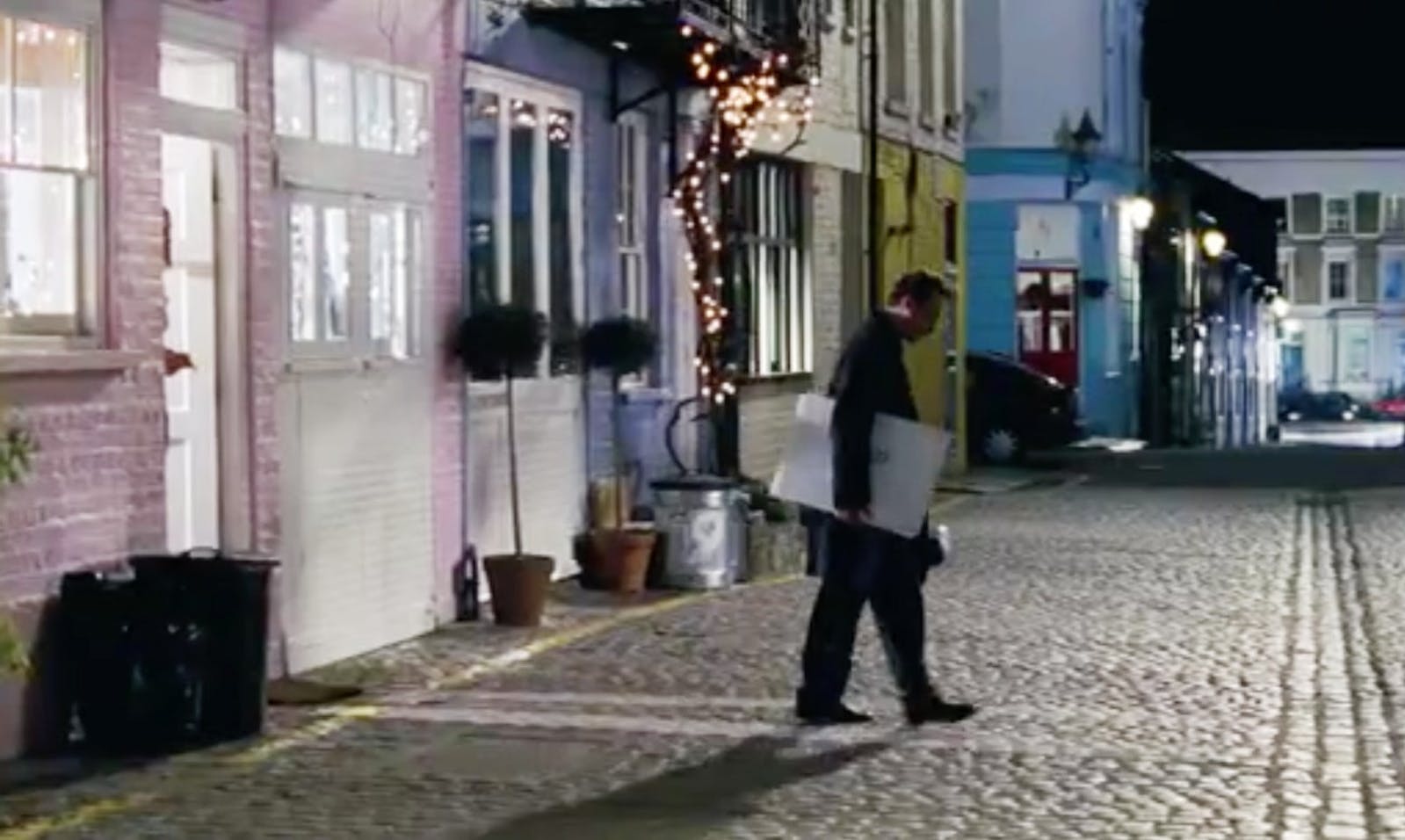 Man standing in colourful street in Notting Hill