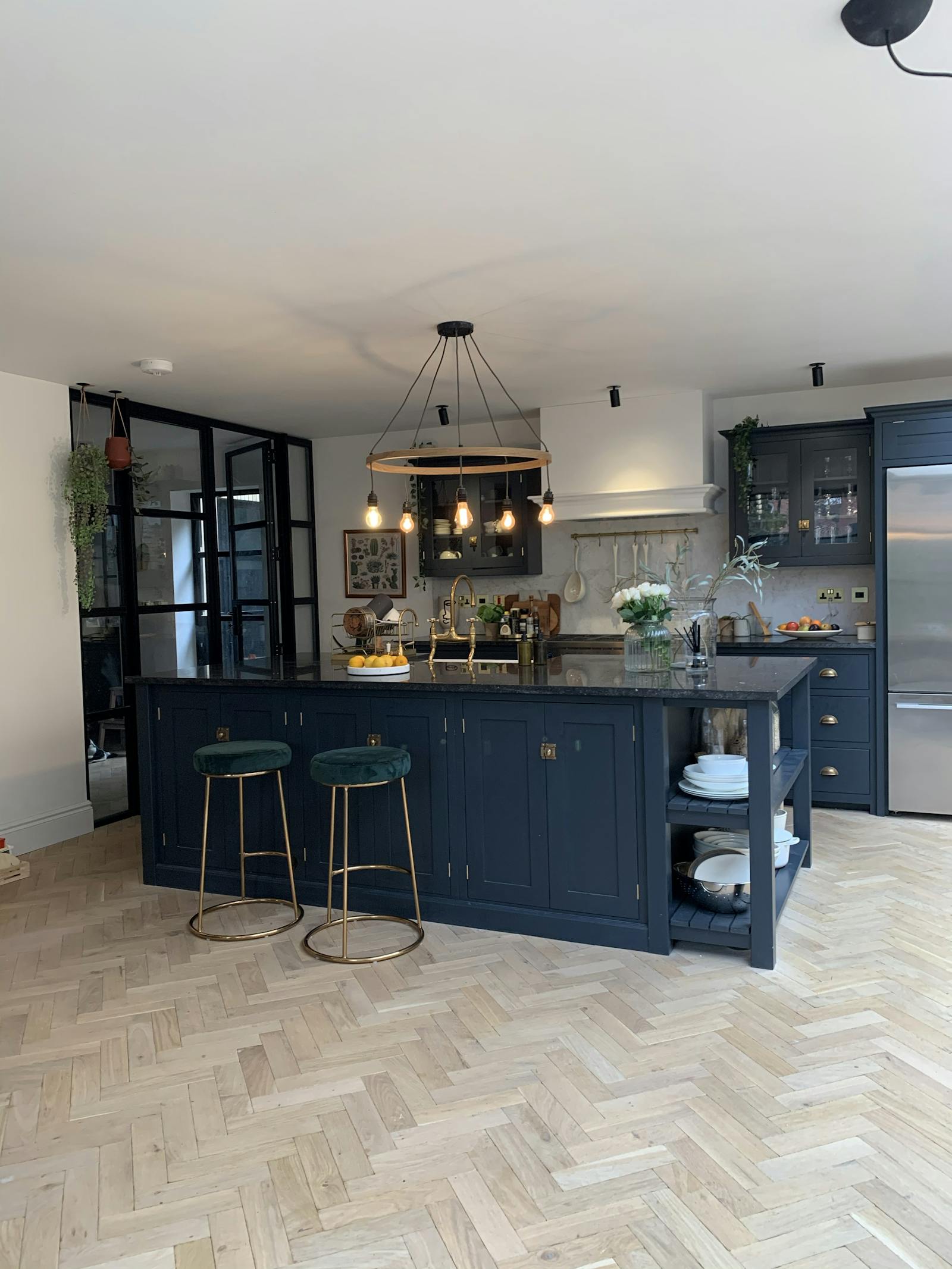 Kitchen with dark cabinets and wooden floor