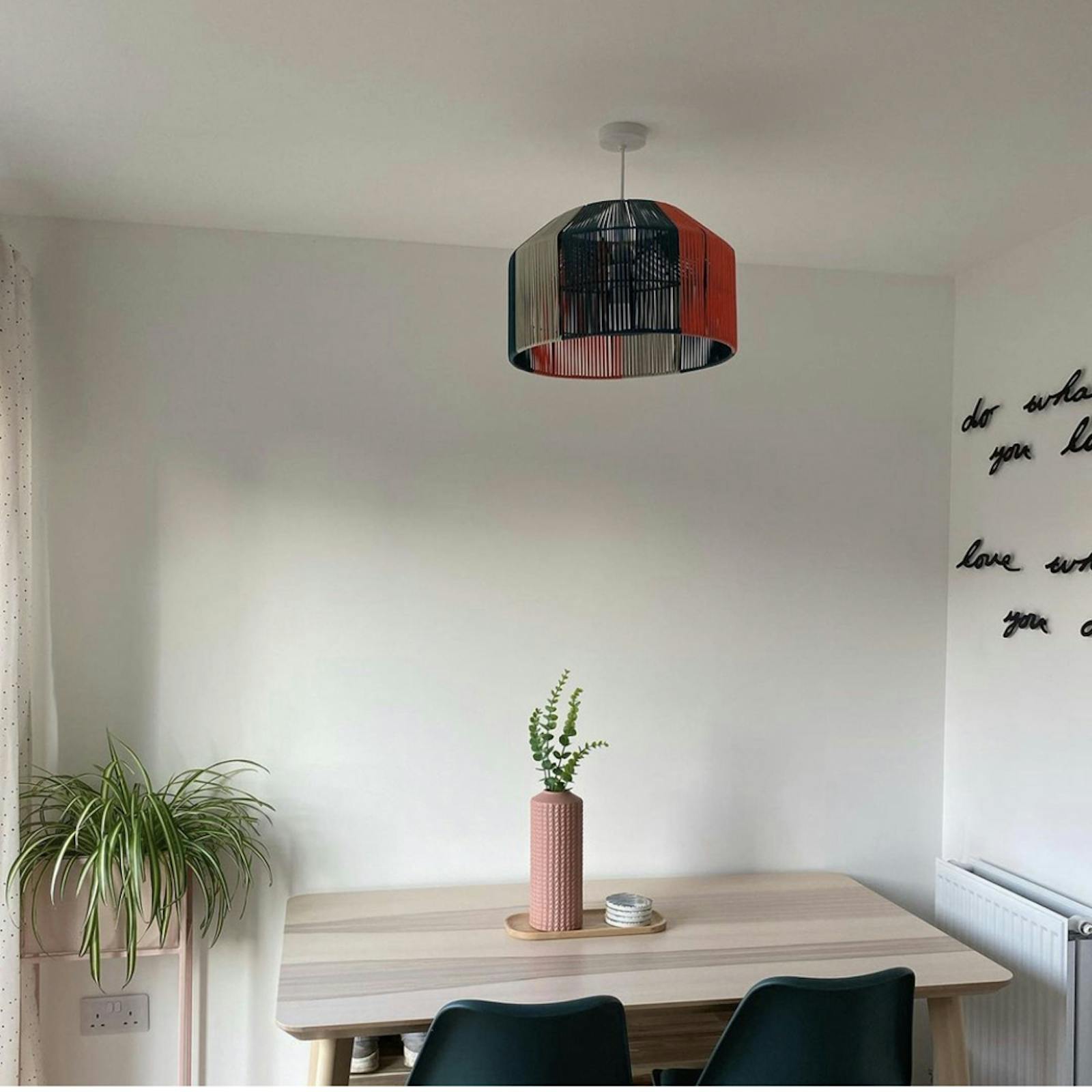 Dining room with white walls and plants