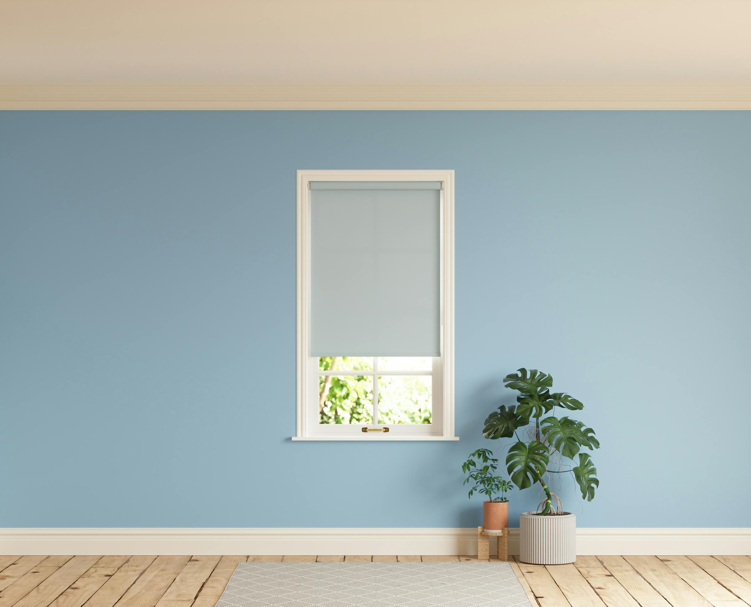 Room with walls painted in Lick Blue 04 and Blue 01 roller blinds