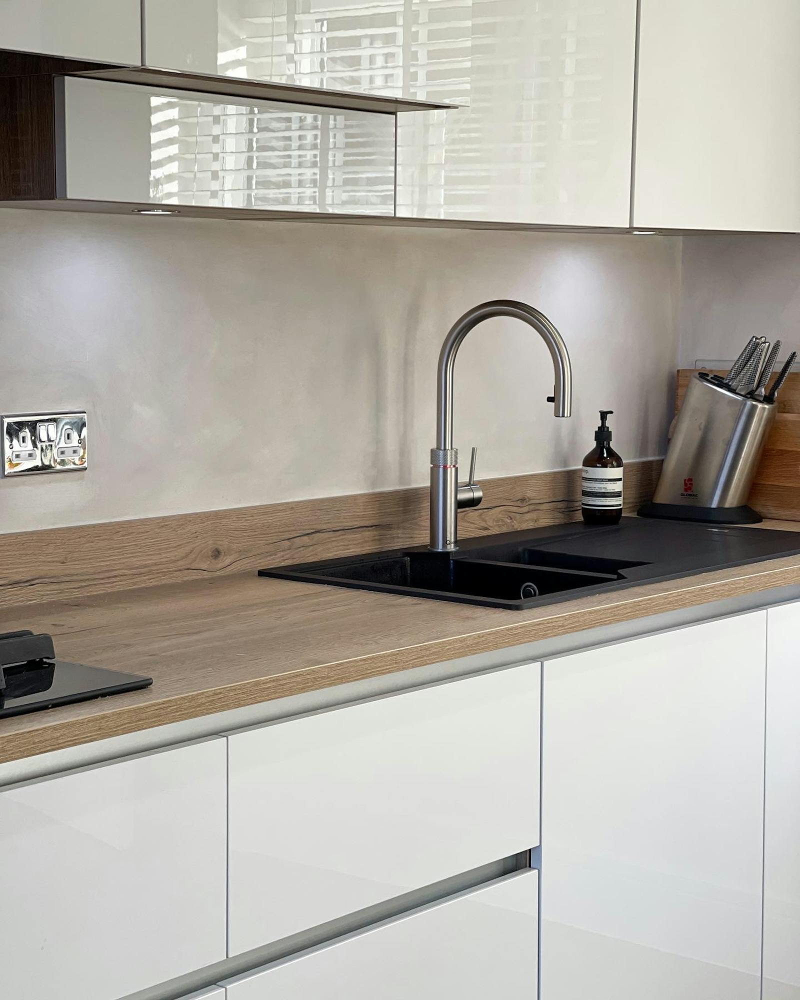 Scandinavian inspired, minimalistic kitchen with white cupboards