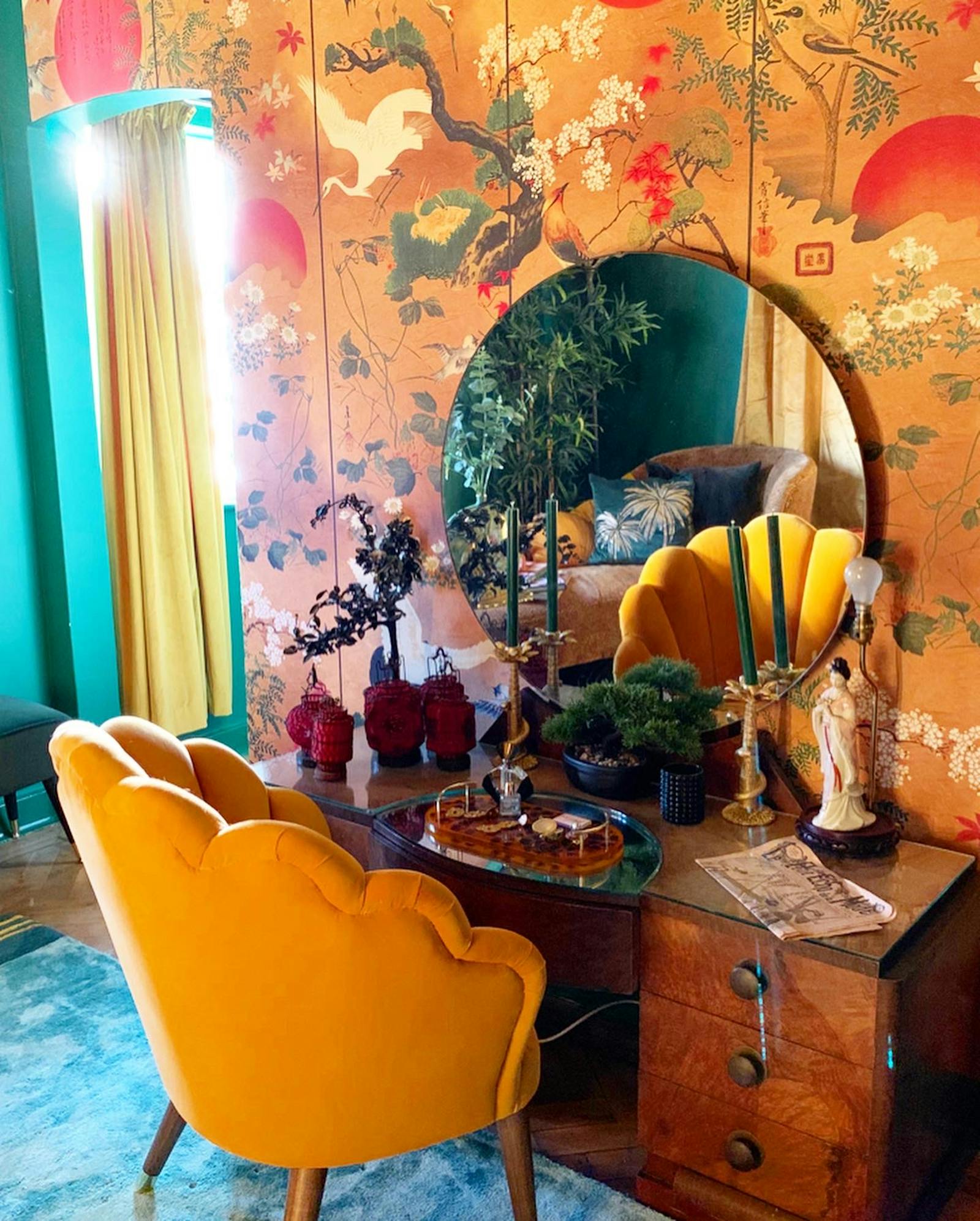 vintage dressing table in front of a Japanese-patterned wallpaper