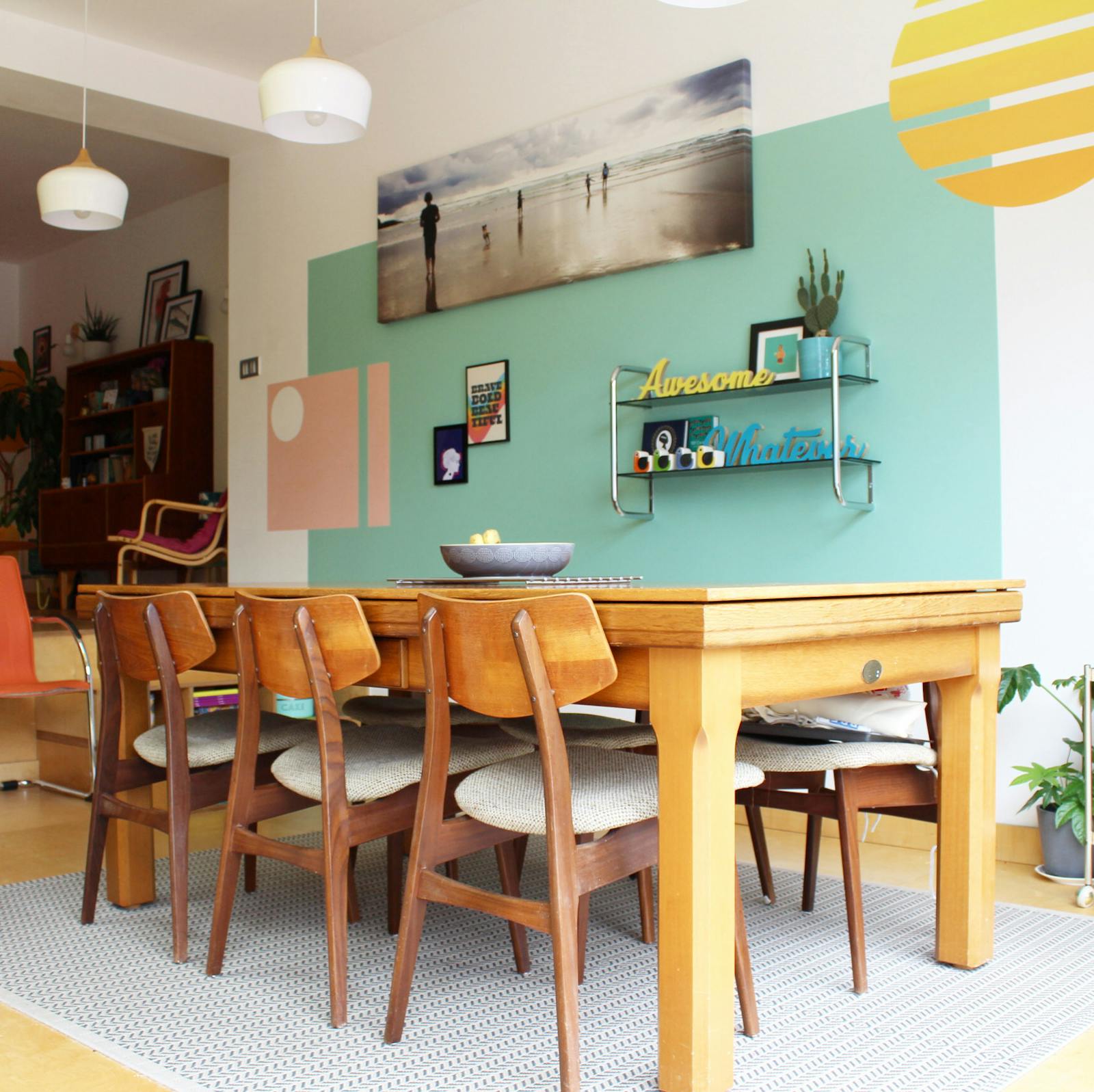 Green 08 painted dining area, with yellow and pink stencilled patterns on the wall
