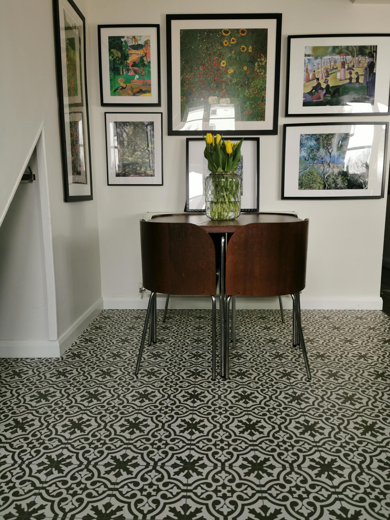 hallway with patterned carpet and a vintage wooden table