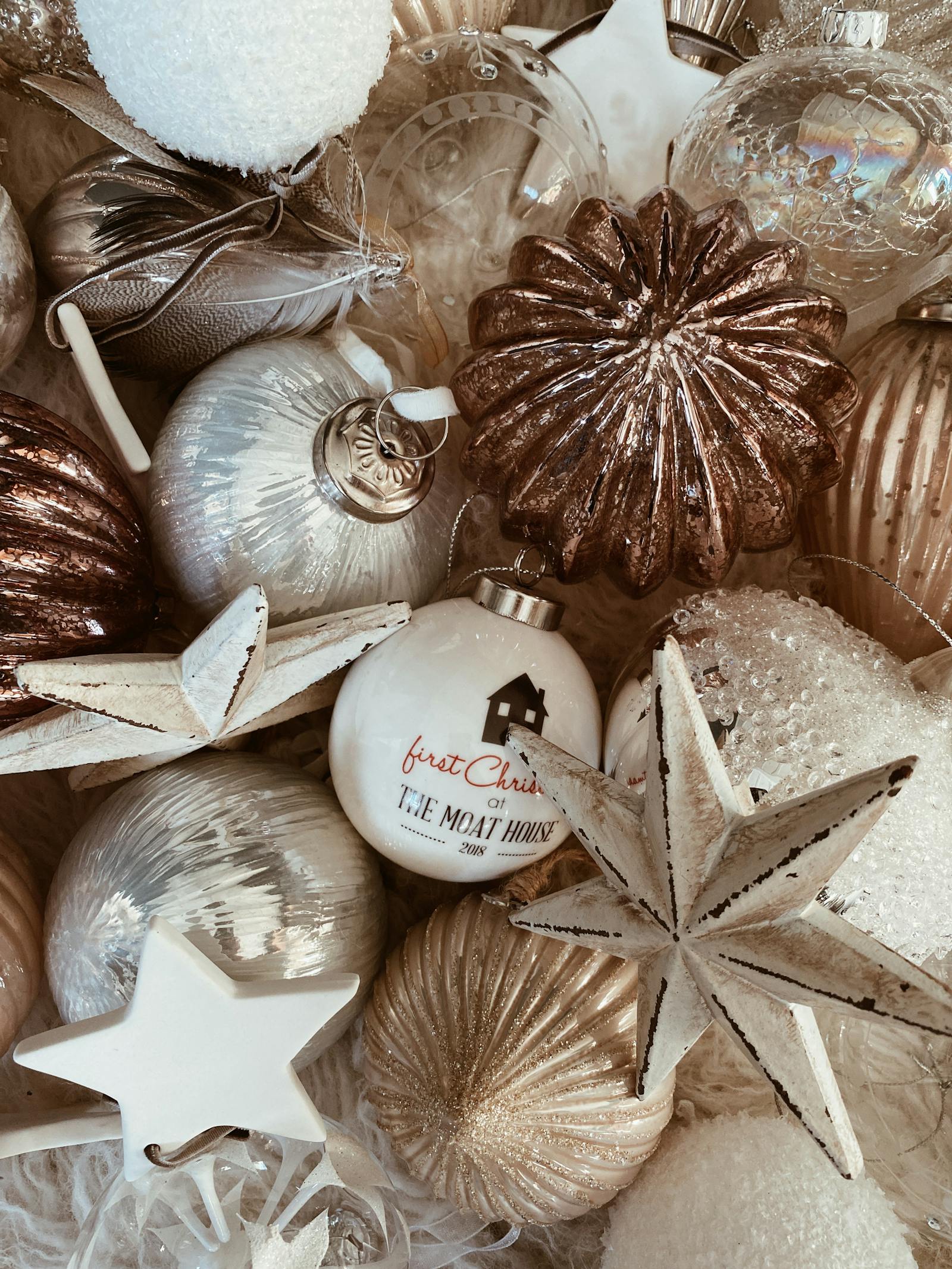 An assortment of bronze and white baubles