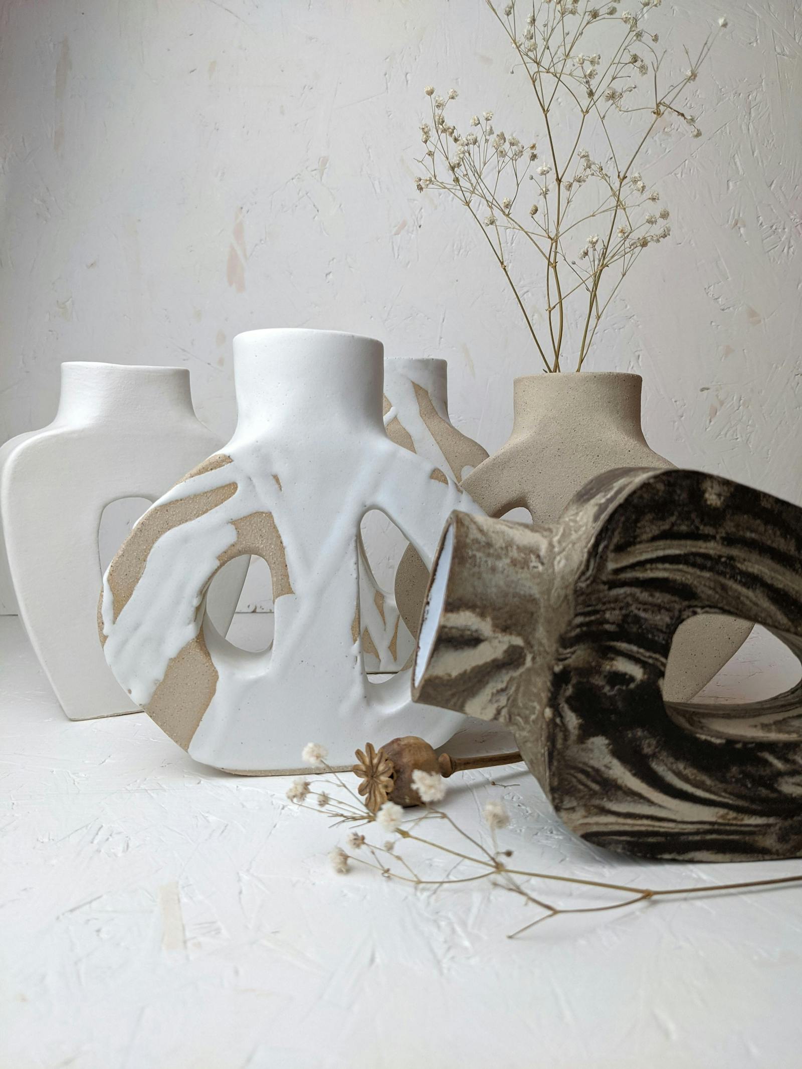 An assortment of vases with unique prints on them