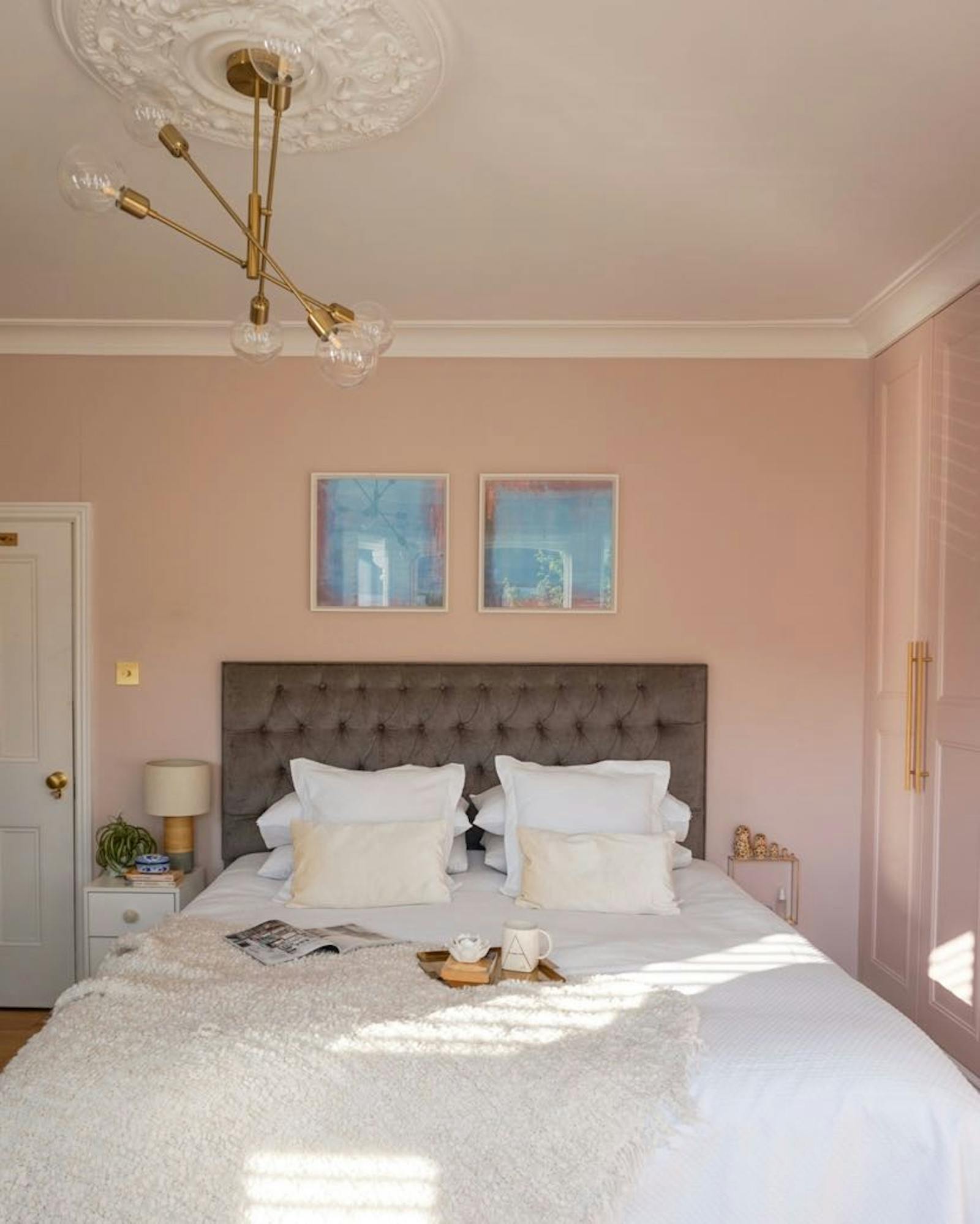 Spacious master bedroom painted in pink