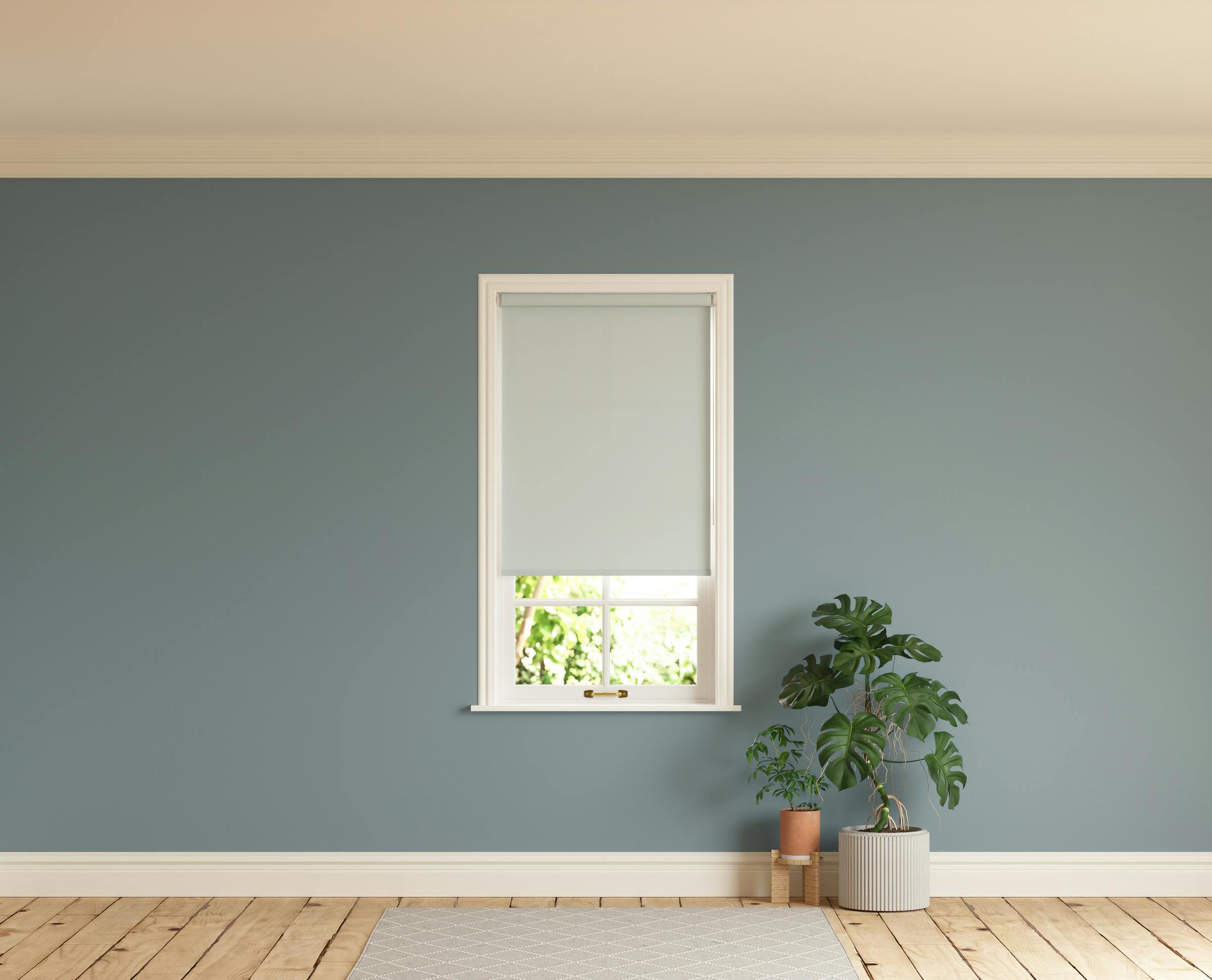 Room with walls painted in Lick Teal 02 and Grey 02 roller blinds