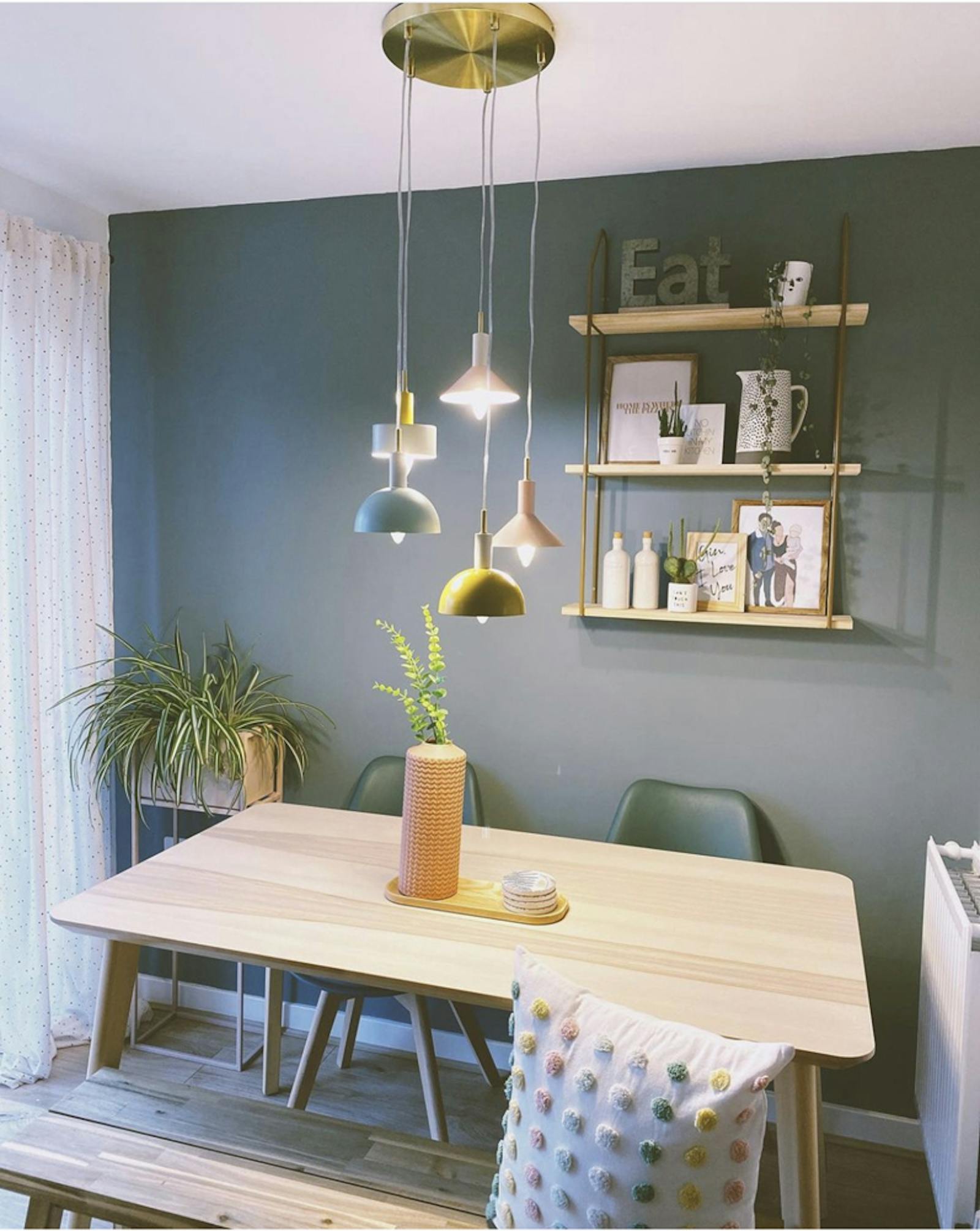 Dining room painted in a Teal shade