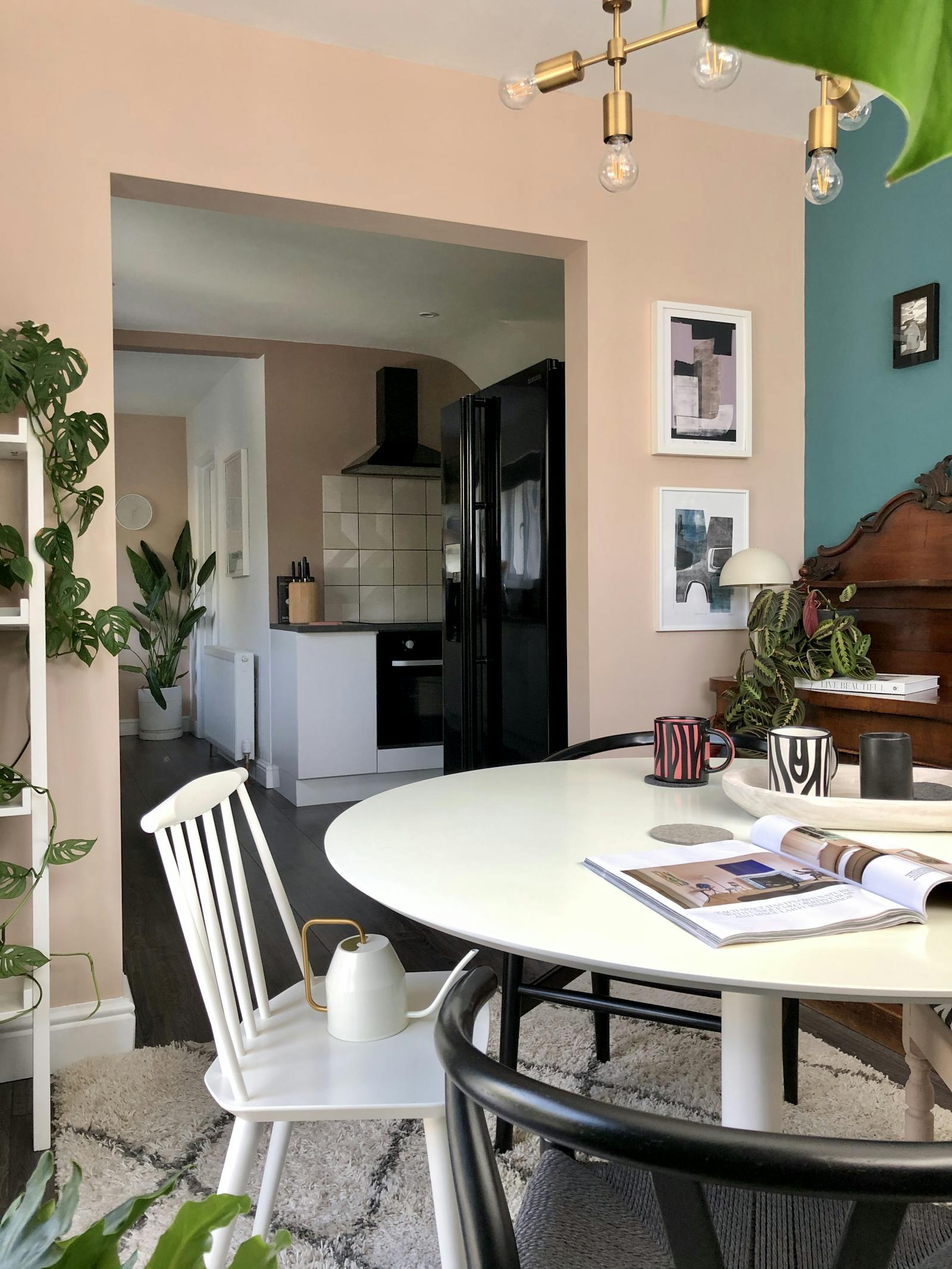 Dining room with turquoise and rose pink walls