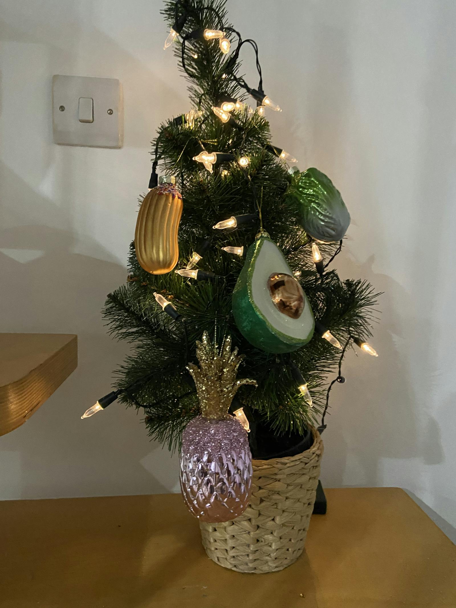 Mini Christmas tree decorated in food-themed baubles