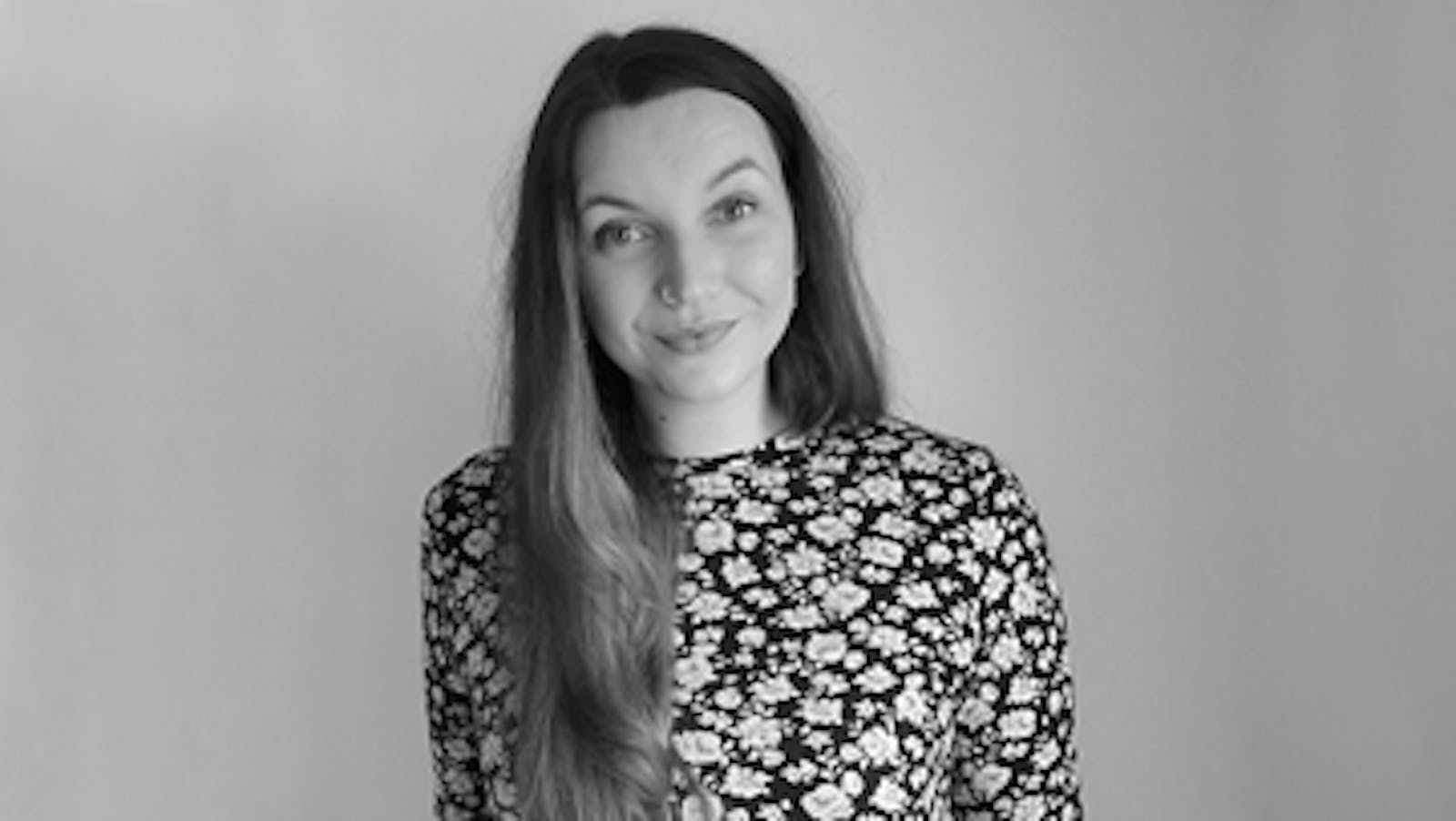 Artist (Belinda) smiling in black and white picture