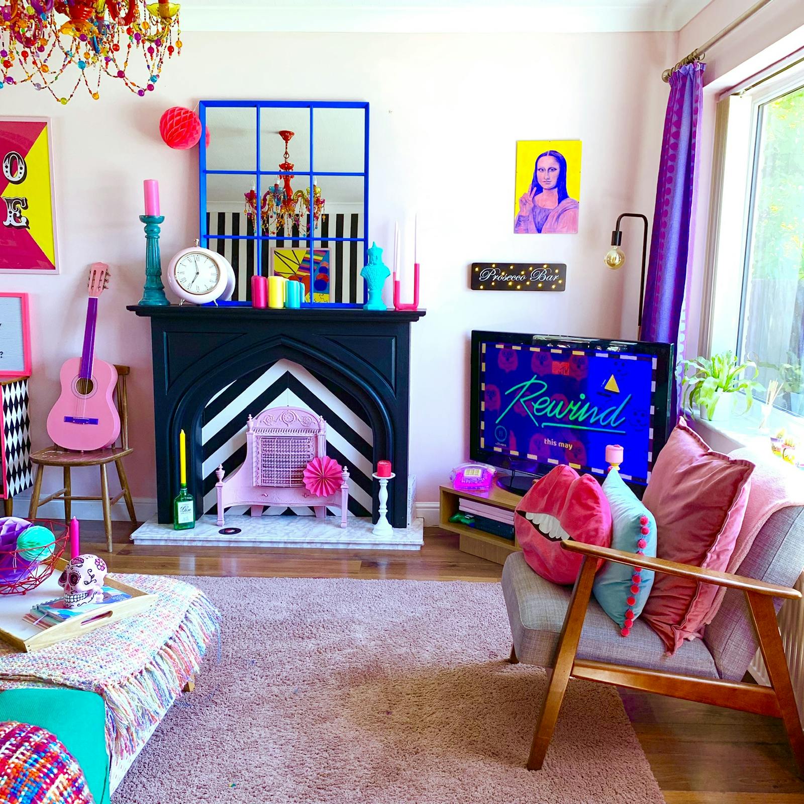 Living room with fireplace and a random assortment of soft furnishings and artwork