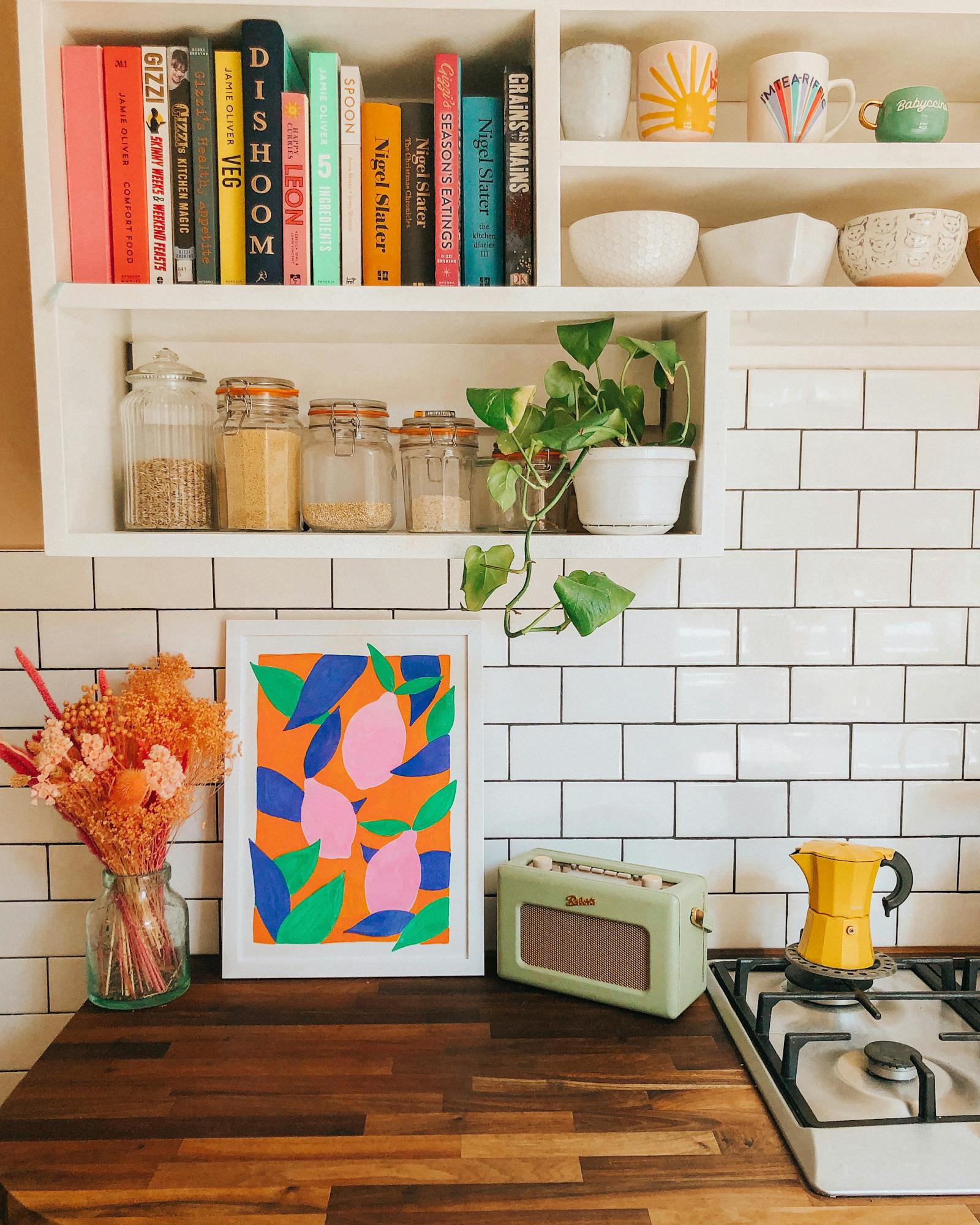 Kitchen with shelves, greenery and metro tiling