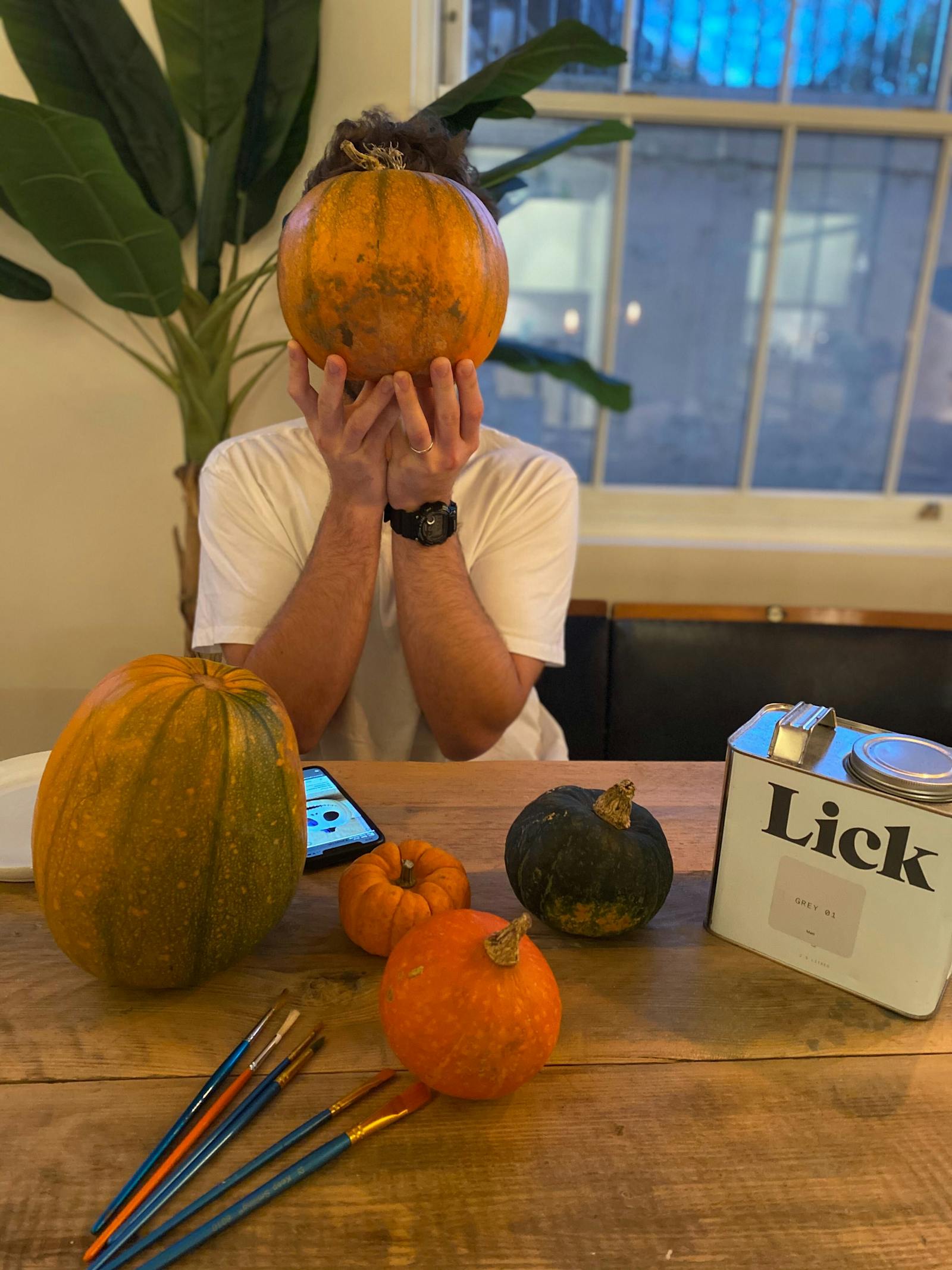 Man holding pumpkin