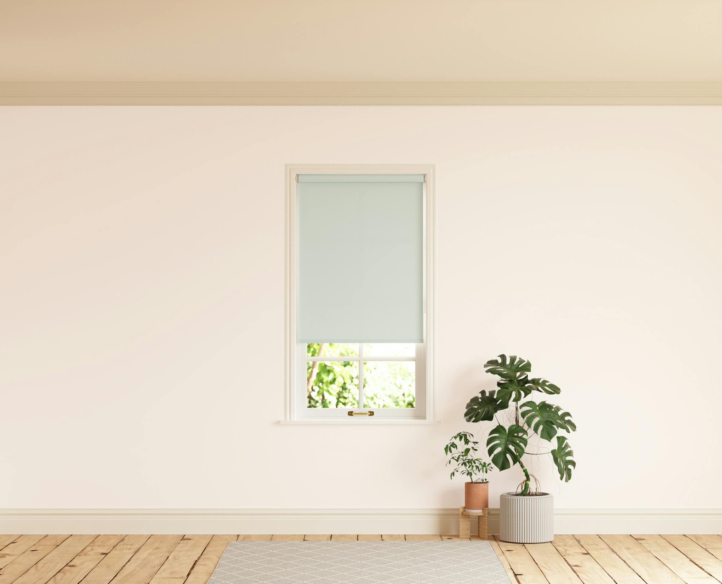 Room with walls painted in Lick Pink 01 and Grey 02 roller blinds
