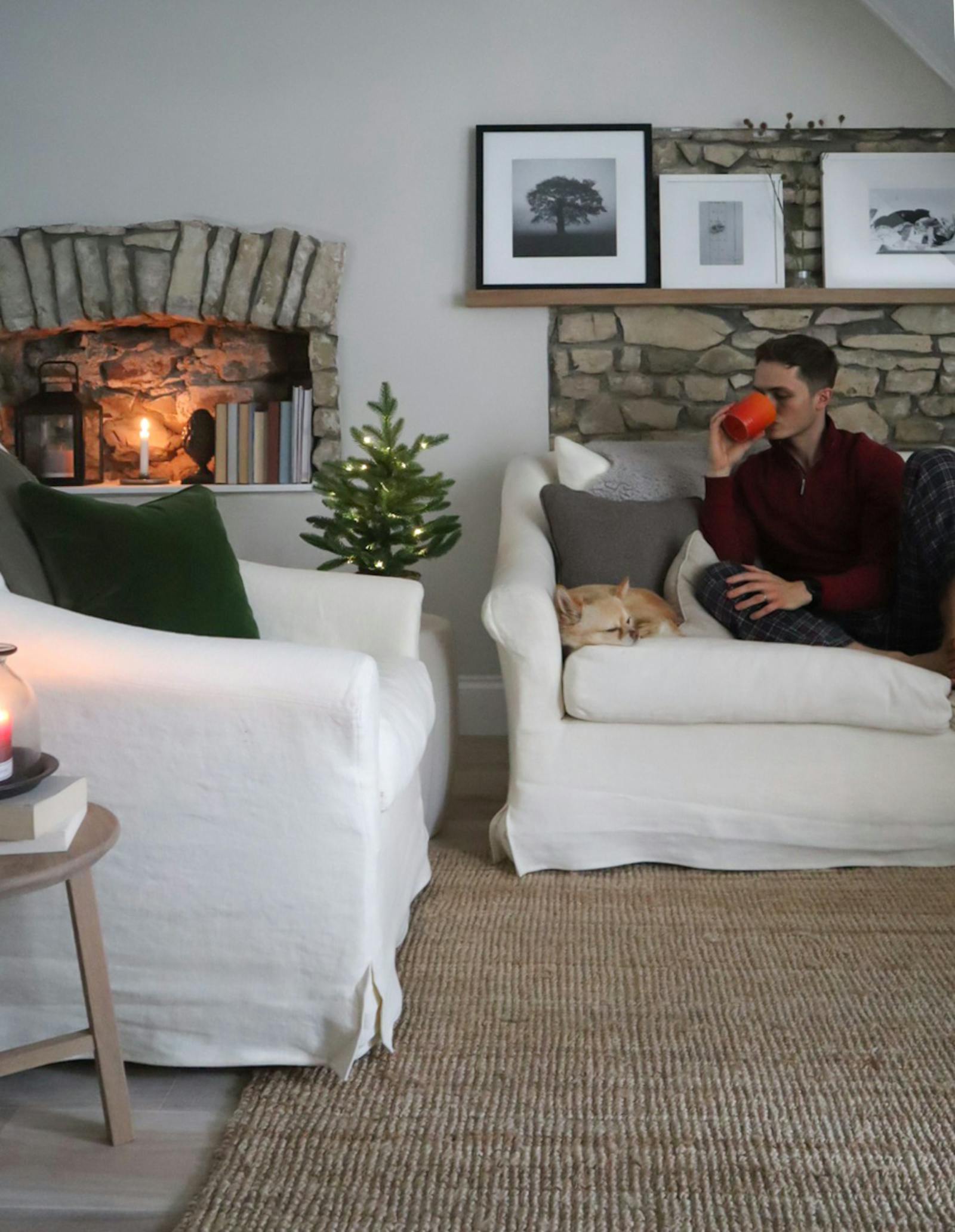 Man sitting on the sofa in a Christmas decorated living room