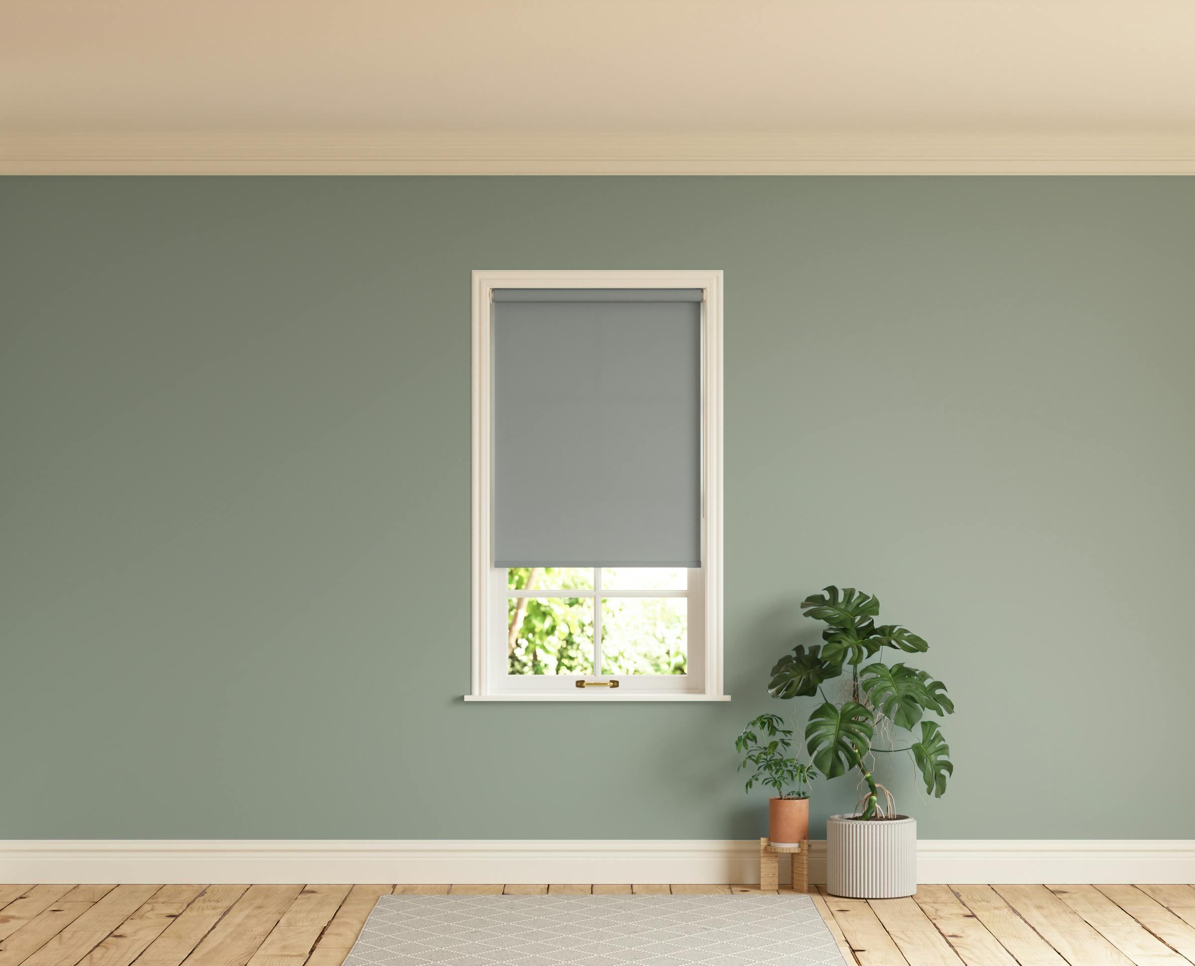 Room with walls painted in Lick Green 02 and Grey 06 roller blinds