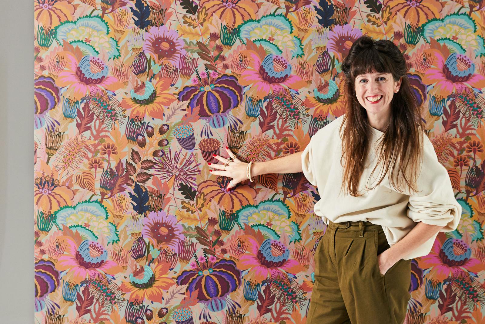 Natasha Coverdale standing in front of Lick Mars Meadow 02 wallpaper