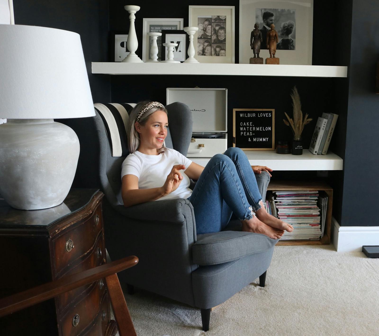 Blonde woman sitting in an armchair
