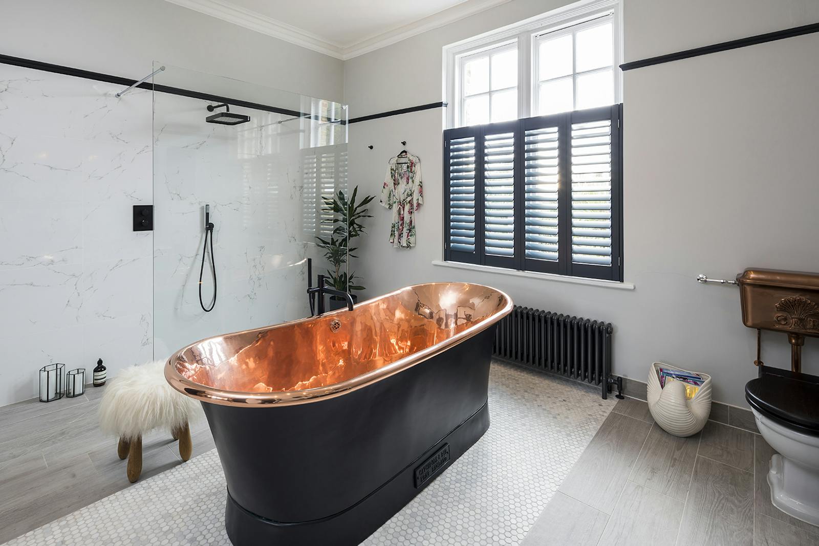 Master bathroom with a black bathtub