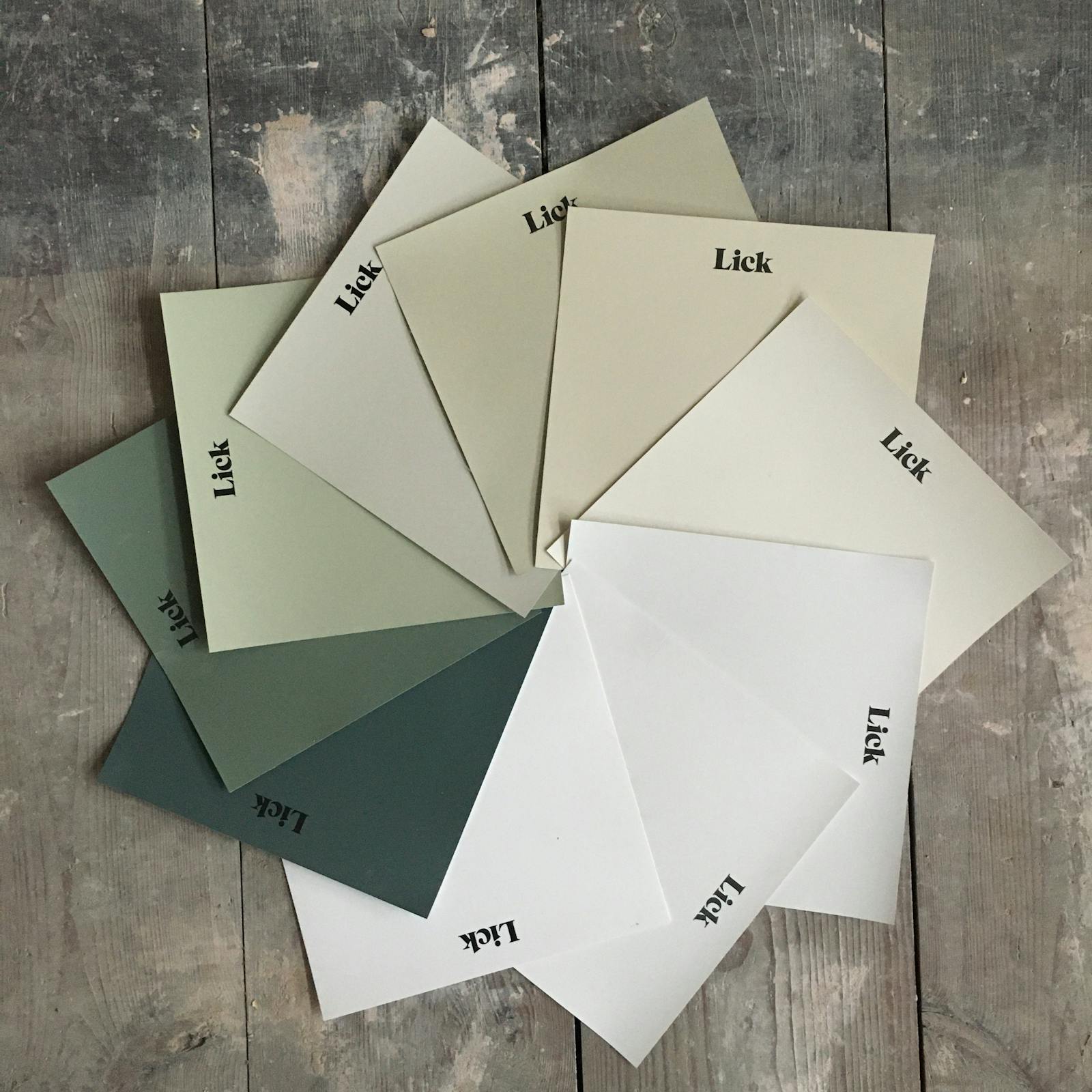 A display of Lick Green and White paint samples