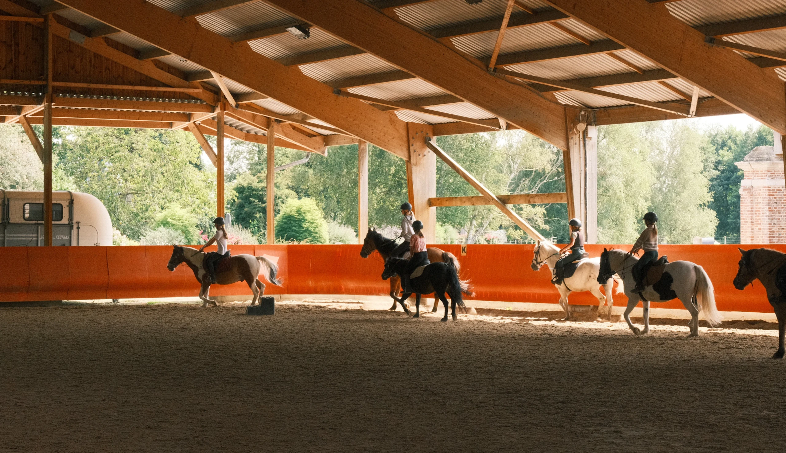 Line of riders walking in the arena