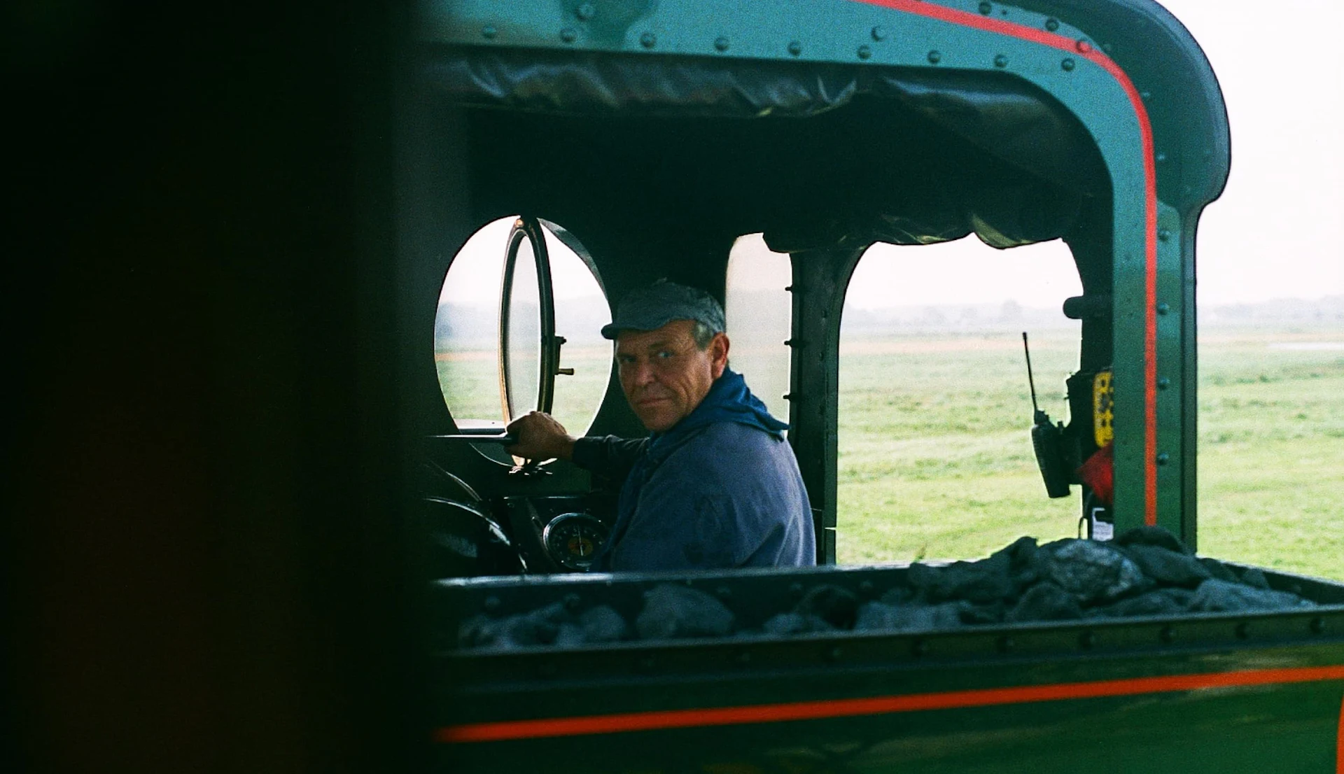 A train driver in the locomotive of the Baie de Somme train